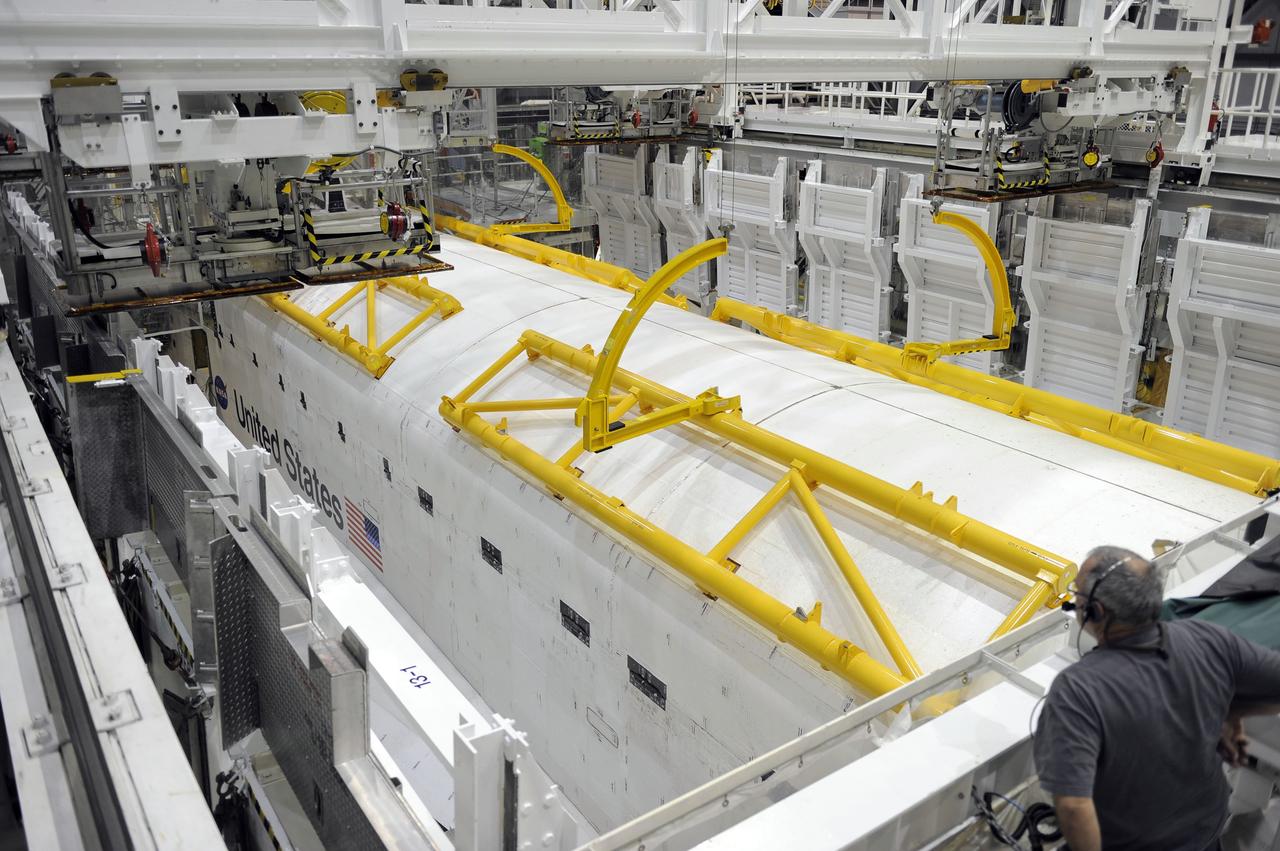 CAPE CANAVERAL, Fla. – In Orbiter Processing Facility-2 at NASA’s Kennedy Space Center in Florida, technicians prepare to open space shuttle Endeavour’s payload bay doors in order to retract an antenna. Space Shuttle Program transition and retirement work continues on Discovery and Endeavour in the orbiter processing facilities, while shuttle Atlantis is in temporary storage in high bay 4 of the Vehicle Assembly Building. Endeavour is being prepared for display at the California Science Center in Los Angeles. Photo credit: NASA/Kim Shiflett