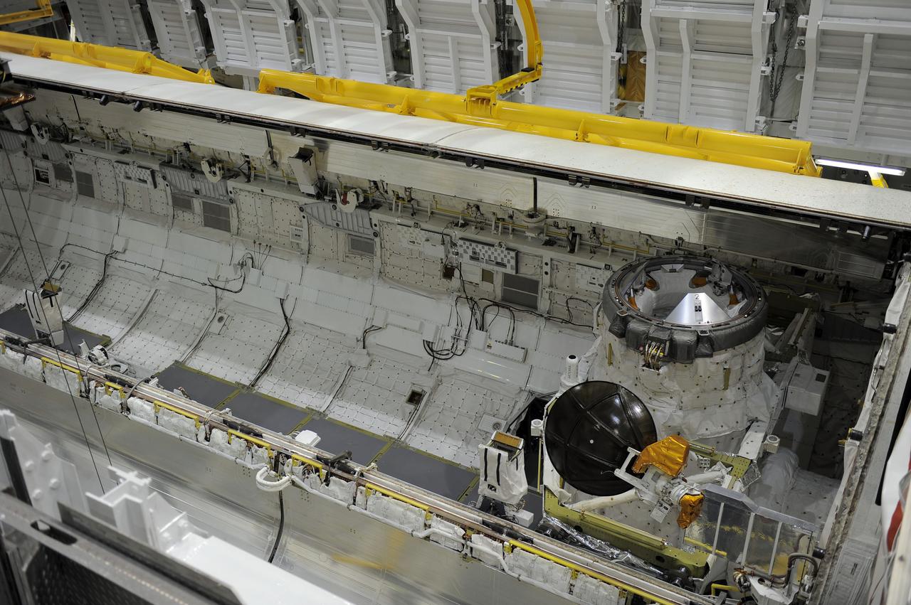 CAPE CANAVERAL, Fla. -- In Orbiter Processing Facility-2 at NASA’s Kennedy Space Center in Florida, one of space shuttle Endeavour’s payload bay doors has been fully opened so that an antenna can be retracted. Space Shuttle Program transition and retirement work continues on Discovery and Endeavour in the orbiter processing facilities, while shuttle Atlantis is in temporary storage in high bay 4 of the Vehicle Assembly Building. Endeavour is being prepared for display at the California Science Center in Los Angeles. Photo credit: NASA/Kim Shiflett