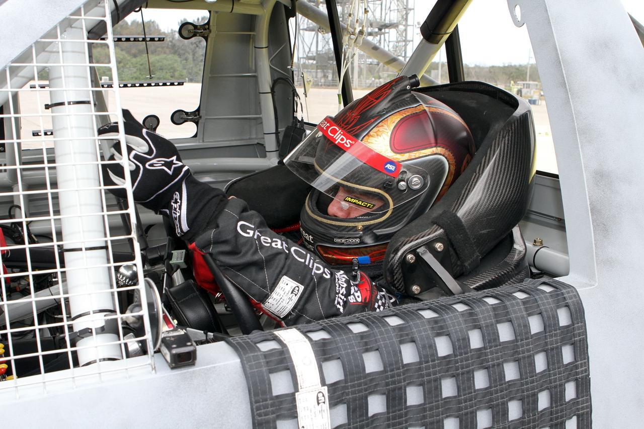CAPE CANAVERAL, Fla. - At NASA’s Kennedy Space Center in Florida, NASCAR racer Jason Leffler with Kyle Busch Motorsports (KBM) prepares to drive his instrument-laden vehicle down the three-mile-long Shuttle Landing Facility runway. The operation is part of KBMs’ program to test aerodynamic and real-world capabilities on one of the flattest surfaces in the world.      Racing teams have been using the runway for testing since 2008. KBM signed a Space Act Agreement with NASA to use the facility’s runway. Photo Credit: NASA/Kim Shiflett