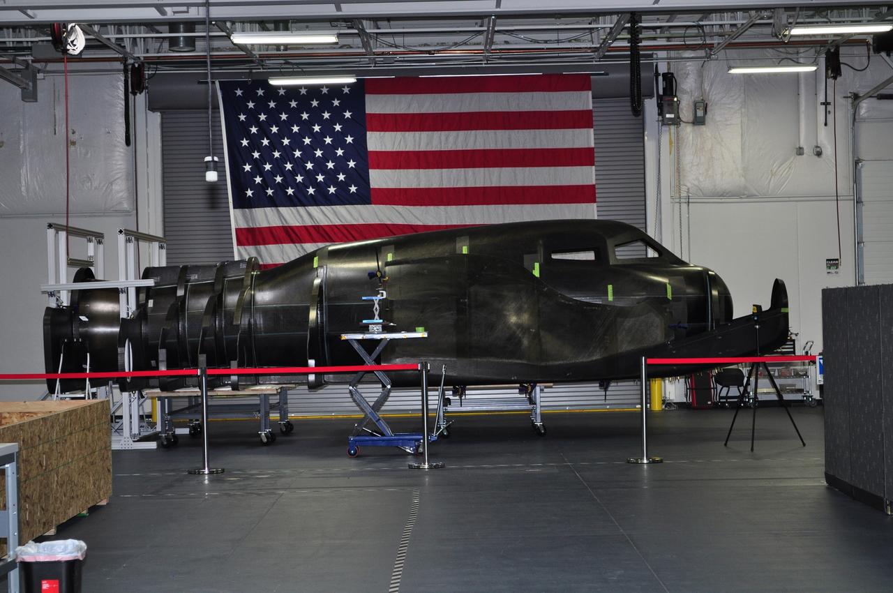 LOUISVILLE, Colo. – During NASA's Commercial Crew Development Round 2 CCDev2) activities for the Commercial Crew Program CCP, Sierra Nevada Corp. SNC delivered the primary structure of its Dream Chaser flight test vehicle to the company’s office in Louisville, Colo. SNC engineers currently are assembling the full-scale prototype, which includes the integration of secondary structures and subsystems. This all-composite structure of the company's planned winged spacecraft, the Dream Chaser, will be used to carry out several remaining CCDev2 milestones including a captive carry flight and the first approach and landing test of the spacecraft. During the captive carry flight, a carrier aircraft will the Dream Chaser vehicle over NASA's Dryden Flight Research Center in Edwards, Calif. Sierra Nevada is one of seven companies NASA entered into Space Act Agreements SAAs with during CCDev2 to aid in the innovation and development of American-led commercial capabilities for crew transportation and rescue services to and from the International Space Station and other low Earth orbit destinations. For information about CCP, visit www.nasa.gov/commercialcrew. Photo credit: Sierra Nevada Corp.