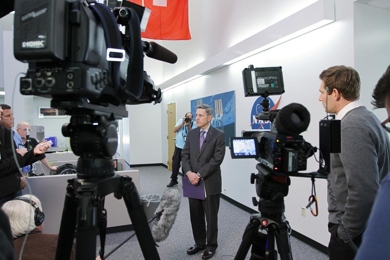 CAPE CANAVERAL, Fla. -- Bob Cabana, director of NASA's Kennedy Space Center in Florida, center, discusses the fiscal year 2013 budget proposal for the space agency, which was released today, with members of the news media at the NASA News Center at Kennedy. Cabana is a former space shuttle astronaut who became the Kennedy director in October 2008. Photo credit: NASA/ Kim Shiflett