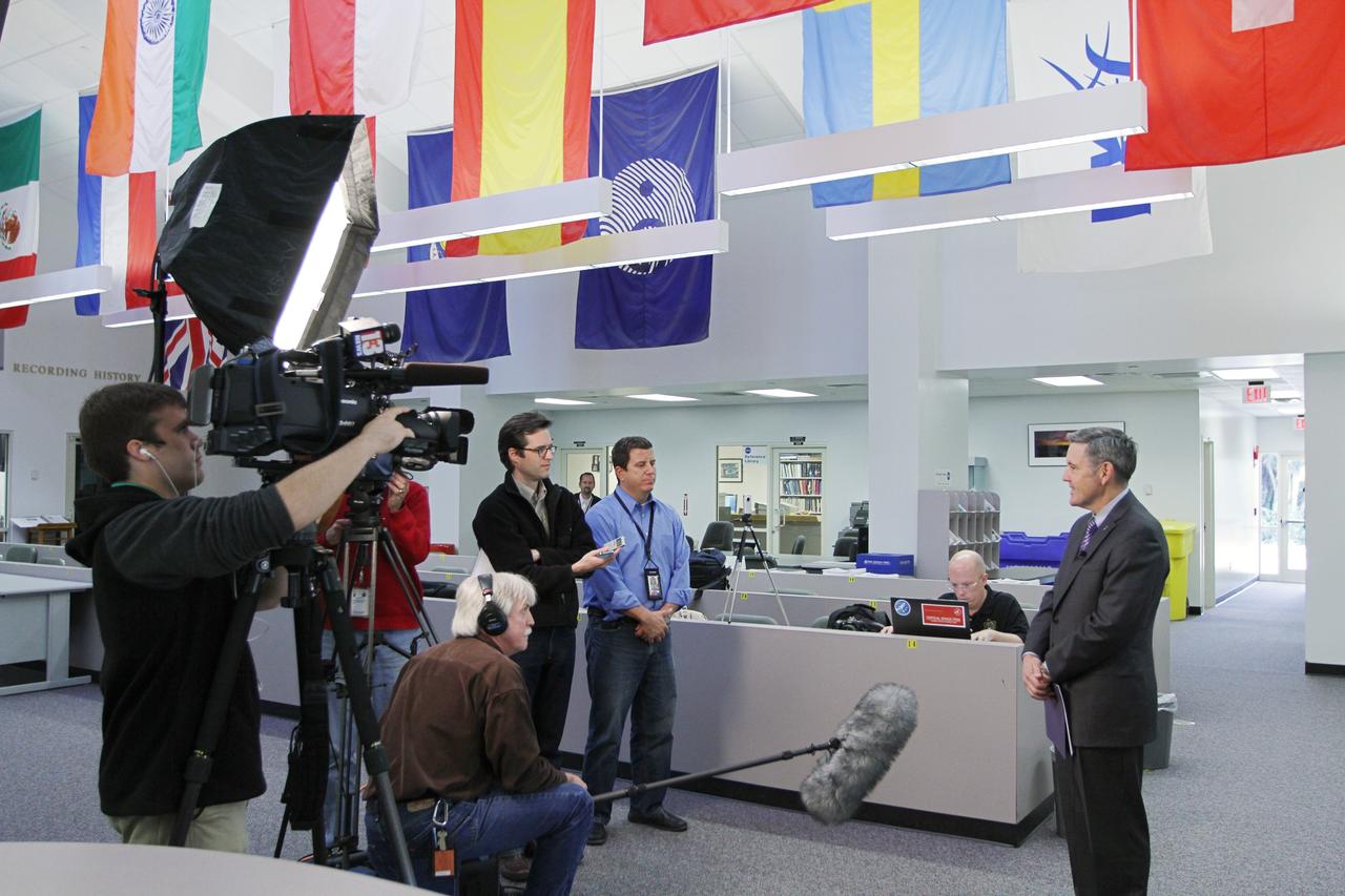 CAPE CANAVERAL, Fla. -- Bob Cabana, director of NASA's Kennedy Space Center in Florida, right, discusses the fiscal year 2013 budget proposal for the space agency, which was released today, with members of the news media at the NASA News Center at Kennedy. Cabana is a former space shuttle astronaut who became the Kennedy director in October 2008. Photo credit: NASA/ Kim Shiflett