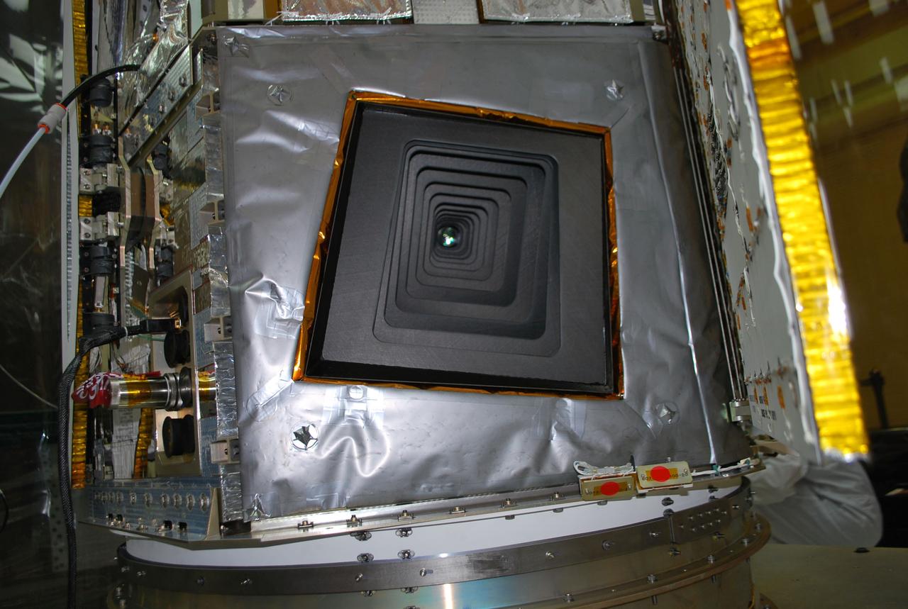 VANDENBERG AIR FORCE BASE, Calif. -- NuSTAR’s X-ray telescope is visible during the solar array deployment test at Vandenberg Air Force Base's processing facility in California.      The Pegasus will launch NASA's Nuclear Spectroscopic Telescope Array NuSTAR into space. After the rocket and spacecraft are processed at Vandenberg, they will be flown on the Orbital Sciences’ L-1011 carrier aircraft to the Ronald Reagan Ballistic Missile Defense Test Site at the Pacific Ocean’s Kwajalein Atoll for launch. The high-energy x-ray telescope will conduct a census for black holes, map radioactive material in young supernovae remnants, and study the origins of cosmic rays and the extreme physics around collapsed stars. For more information, visit science.nasa.gov/missions/nustar/. Photo credit: NASA/Randy Beaudoin, VAFB