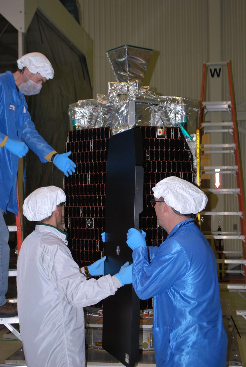 VANDENBERG AIR FORCE BASE, Calif. -- At Vandenberg Air Force Base's processing facility in California, technicians prepare NASA’s NuSTAR spacecraft to be lifted into a tilt-rotation fixture. The spacecraft will be rotated to horizontal for joining with the Pegasus XL rocket. The Orbital Sciences Pegasus will launch NASA's Nuclear Spectroscopic Telescope Array NuSTAR into space. After the rocket and spacecraft are processed at Vandenberg, they will be flown on Orbital's L-1011 carrier aircraft to the Ronald Reagan Ballistic Missile Defense Test Site at the Pacific Ocean’s Kwajalein Atoll for launch. The high-energy x-ray telescope will conduct a census for black holes, map radioactive material in young supernovae remnants, and study the origins of cosmic rays and the extreme physics around collapsed stars. For more information, visit science.nasa.gov/missions/nustar/. Photo credit: NASA/Randy Beaudoin, VAFB