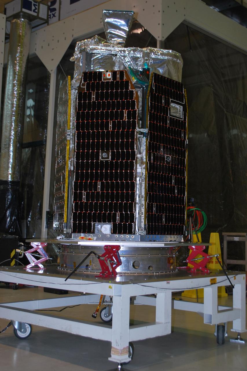 VANDENBERG AIR FORCE BASE, Calif. -- NASA's NuSTAR spacecraft sits on a test stand before it is lifted inside Orbital Sciences' processing facility at Vandenberg Air Force Base, Calif. The spacecraft will be rotated to horizontal for joining with the Pegasus XL rocket. The Orbital Sciences Pegasus will launch NASA's Nuclear Spectroscopic Telescope Array NuSTAR into space. After the rocket and spacecraft are processed at Vandenberg, they will be flown on Orbital's L-1011 carrier aircraft to the Ronald Reagan Ballistic Missile Defense Test Site at the Pacific Ocean’s Kwajalein Atoll for launch. The high-energy x-ray telescope will conduct a census for black holes, map radioactive material in young supernovae remnants, and study the origins of cosmic rays and the extreme physics around collapsed stars. For more information, visit science.nasa.gov/missions/nustar/. Photo credit: NASA/Randy Beaudoin, VAFB