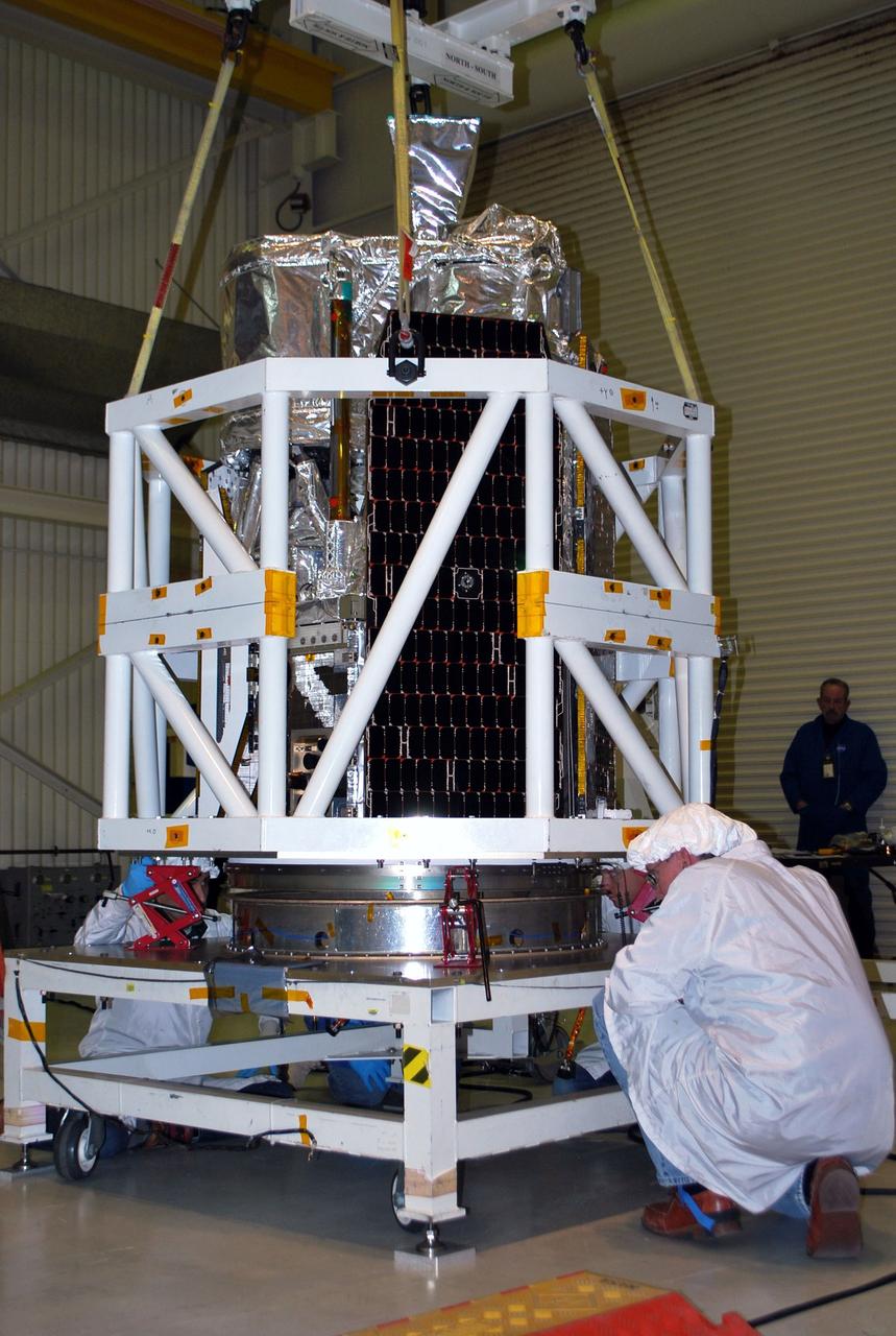 VANDENBERG AIR FORCE BASE, Calif. -- Inside Orbital Sciences' processing facility at Vandenberg Air Force Base in California, a technician watches closely as NASA's NuSTAR spacecraft begins to rise from its test stand. The spacecraft will be rotated to horizontal for joining with the Pegasus XL rocket. The Orbital Sciences Pegasus will launch NASA's Nuclear Spectroscopic Telescope Array NuSTAR into space. After the rocket and spacecraft are processed at Vandenberg, they will be flown on Orbital's L-1011 carrier aircraft to the Ronald Reagan Ballistic Missile Defense Test Site at the Pacific Ocean’s Kwajalein Atoll for launch. The high-energy x-ray telescope will conduct a census for black holes, map radioactive material in young supernovae remnants, and study the origins of cosmic rays and the extreme physics around collapsed stars. For more information, visit science.nasa.gov/missions/nustar/. Photo credit: NASA/Randy Beaudoin, VAFB