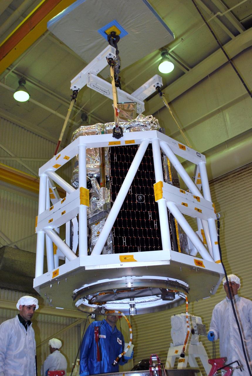 VANDENBERG AIR FORCE BASE, Calif. -- NASA's NuSTAR spacecraft is lifted inside Orbital Sciences' processing facility at Vandenberg Air Force Base, Calif. The spacecraft will be rotated to horizontal for joining with the Pegasus XL rocket. The Orbital Sciences Pegasus will launch NASA's Nuclear Spectroscopic Telescope Array NuSTAR into space. After the rocket and spacecraft are processed at Vandenberg, they will be flown on Orbital's L-1011 carrier aircraft to the Ronald Reagan Ballistic Missile Defense Test Site at the Pacific Ocean’s Kwajalein Atoll for launch. The high-energy x-ray telescope will conduct a census for black holes, map radioactive material in young supernovae remnants, and study the origins of cosmic rays and the extreme physics around collapsed stars. For more information, visit science.nasa.gov/missions/nustar/. Photo credit: NASA/Randy Beaudoin, VAFB