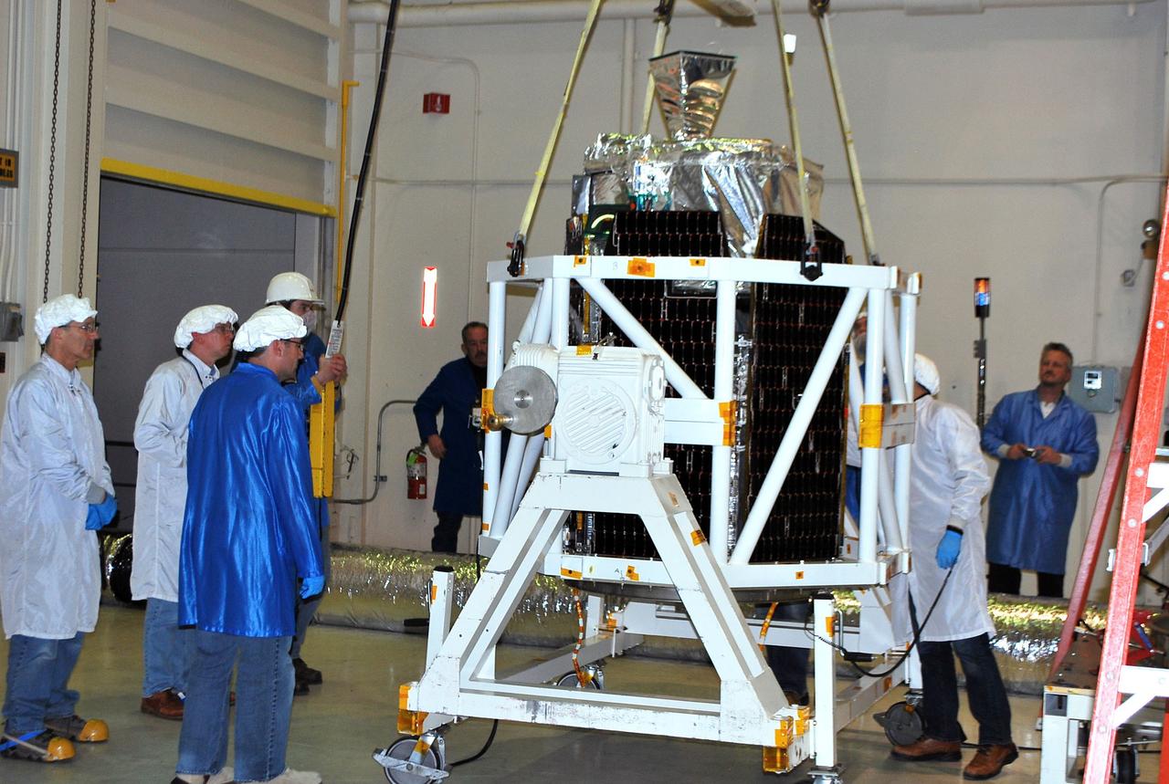 VANDENBERG AIR FORCE BASE, Calif. -- Inside Orbital Sciences' processing facility at Vandenberg Air Force Base in California, NASA's NuSTAR spacecraft has been placed into a tilt-rotation fixture. The spacecraft will be rotated to horizontal for joining with the Pegasus XL rocket. The Orbital Sciences Pegasus will launch NASA's Nuclear Spectroscopic Telescope Array NuSTAR into space. After the rocket and spacecraft are processed at Vandenberg, they will be flown on Orbital's L-1011 carrier aircraft to the Ronald Reagan Ballistic Missile Defense Test Site at the Pacific Ocean’s Kwajalein Atoll for launch. The high-energy x-ray telescope will conduct a census for black holes, map radioactive material in young supernovae remnants, and study the origins of cosmic rays and the extreme physics around collapsed stars. For more information, visit science.nasa.gov/missions/nustar/. Photo credit: NASA/Randy Beaudoin, VAFB