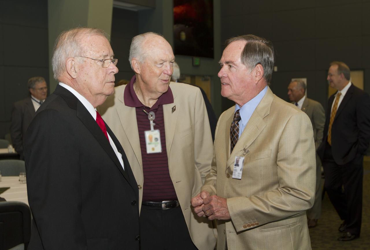 CAPE CANAVERAL, Fla. - Former Kennedy Space Center directors Jay Honeycutt, left, and Bob Crippen, right, talk during a luncheon Feb. 17, 2012, celebrating 50 years of Americans in orbit, an era which began with Glenn's Mercury mission MA-6, on Feb. 20, 1962. Glenn's launch aboard an Atlas rocket took with it the hopes of an entire nation and ushered in a new era of space travel that eventually led to Americans walking on the moon by the end of the 1960s. Glenn soon was followed into orbit by Scott Carpenter, Walter Schirra and Gordon Cooper. Their fellow Mercury astronauts Alan Shepard and Virgil "Gus" Grissom flew earlier suborbital flights. Deke Slayton, a member of NASA's original Mercury 7 astronauts, was grounded by a medical condition until the Apollo-Soyuz Test Project in 1975. Photo credit: NASA/Kim Shiflett