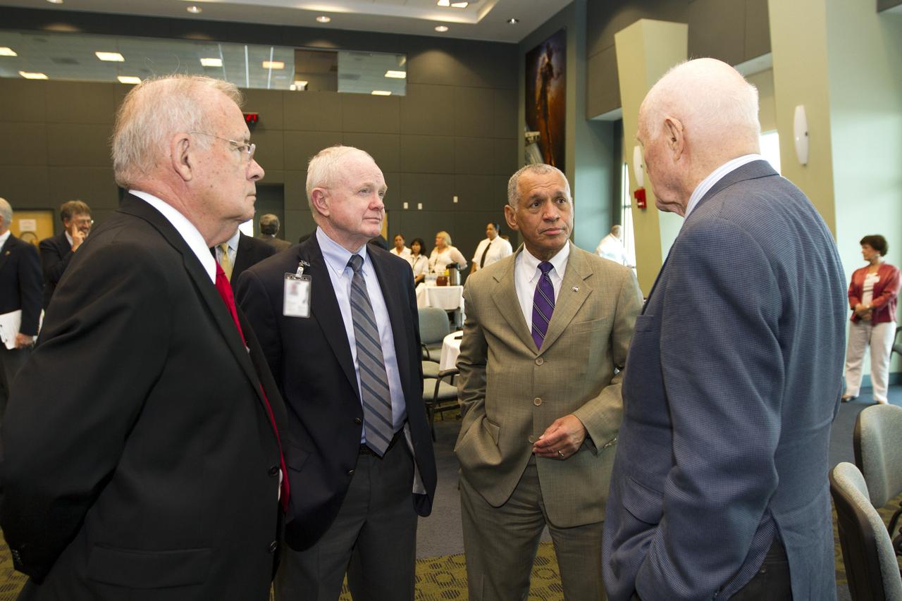 CAPE CANAVERAL, Fla. - Former Kennedy Space Center directors Jay Honeycutt, left, Roy Bridges and NASA Administrator Charles Bolden talk with astronaut John Glenn before a luncheon Feb. 17, 2012 celebrating 50 years of Americans in orbit, an era which began with Glenn's Mercury mission MA-6, on Feb. 20, 1962.  Glenn's launch aboard an Atlas rocket took with it the hopes of an entire nation and ushered in a new era of space travel that eventually led to Americans walking on the moon by the end of the 1960s. Glenn soon was followed into orbit by Scott Carpenter, Walter Schirra and Gordon Cooper. Their fellow Mercury astronauts Alan Shepard and Virgil "Gus" Grissom flew earlier suborbital flights. Deke Slayton, a member of NASA's original Mercury 7 astronauts, was grounded by a medical condition until the Apollo-Soyuz Test Project in 1975. Photo credit: NASA/Kim Shiflett