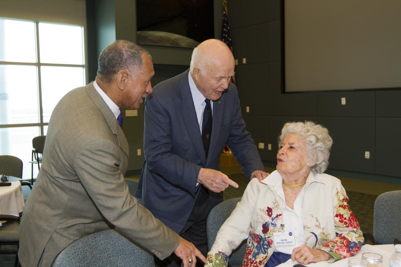 CAPE CANAVERAL, Fla. - NASA Administrator Charles Bolden, left, talks with astronaut John Glenn and his wife, Annie Glenn, before a luncheon Feb. 17, 2012, celebrating 50 years of Americans in orbit, an era which began with Glenn's Mercury mission MA-6, on Feb. 20, 1962.  Glenn's launch aboard an Atlas rocket took with it the hopes of an entire nation and ushered in a new era of space travel that eventually led to Americans walking on the moon by the end of the 1960s. Glenn soon was followed into orbit by Scott Carpenter, Walter Schirra and Gordon Cooper. Their fellow Mercury astronauts Alan Shepard and Virgil "Gus" Grissom flew earlier suborbital flights. Deke Slayton, a member of NASA's original Mercury 7 astronauts, was grounded by a medical condition until the Apollo-Soyuz Test Project in 1975. Photo credit: NASA/Kim Shiflett
