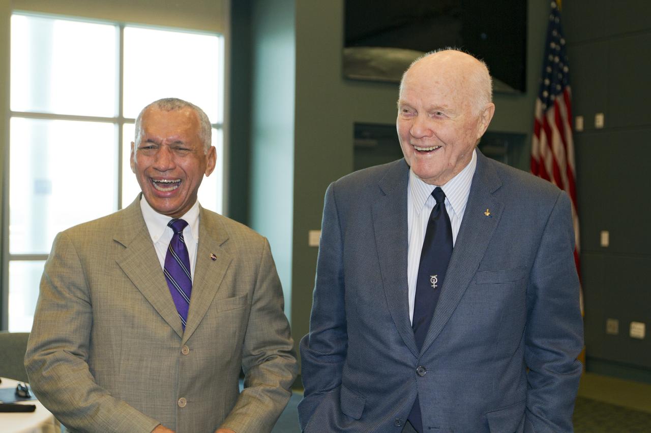 CAPE CANAVERAL, Fla. - NASA Administrator Charles Bolden, left, shares a laugh with astronaut John Glenn before a luncheon Feb. 17, 2012, celebrating 50 years of Americans in orbit, an era which began with Glenn's Mercury mission MA-6, on Feb. 20, 1962.  Glenn's launch aboard an Atlas rocket took with it the hopes of an entire nation and ushered in a new era of space travel that eventually led to Americans walking on the moon by the end of the 1960s. Glenn soon was followed into orbit by Scott Carpenter, Walter Schirra and Gordon Cooper. Their fellow Mercury astronauts Alan Shepard and Virgil "Gus" Grissom flew earlier suborbital flights. Deke Slayton, a member of NASA's original Mercury 7 astronauts, was grounded by a medical condition until the Apollo-Soyuz Test Project in 1975. Photo credit: NASA/Kim Shiflett