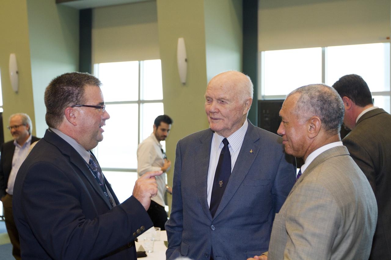 CAPE CANAVERAL, Fla. - Ed Mango, program manager of NASA's Commercial Crew Program, left, talks with astronaut John Glenn, center and NASA Administrator Charles Bolden before a luncheon Feb. 17, 2012, celebrating 50 years of Americans in orbit, an era which began with Glenn's Mercury mission MA-6, on Feb. 20, 1962.  Glenn's launch aboard an Atlas rocket took with it the hopes of an entire nation and ushered in a new era of space travel that eventually led to Americans walking on the moon by the end of the 1960s. Glenn soon was followed into orbit by Scott Carpenter, Walter Schirra and Gordon Cooper. Their fellow Mercury astronauts Alan Shepard and Virgil "Gus" Grissom flew earlier suborbital flights. Deke Slayton, a member of NASA's original Mercury 7 astronauts, was grounded by a medical condition until the Apollo-Soyuz Test Project in 1975. Photo credit: NASA/Kim Shiflett
