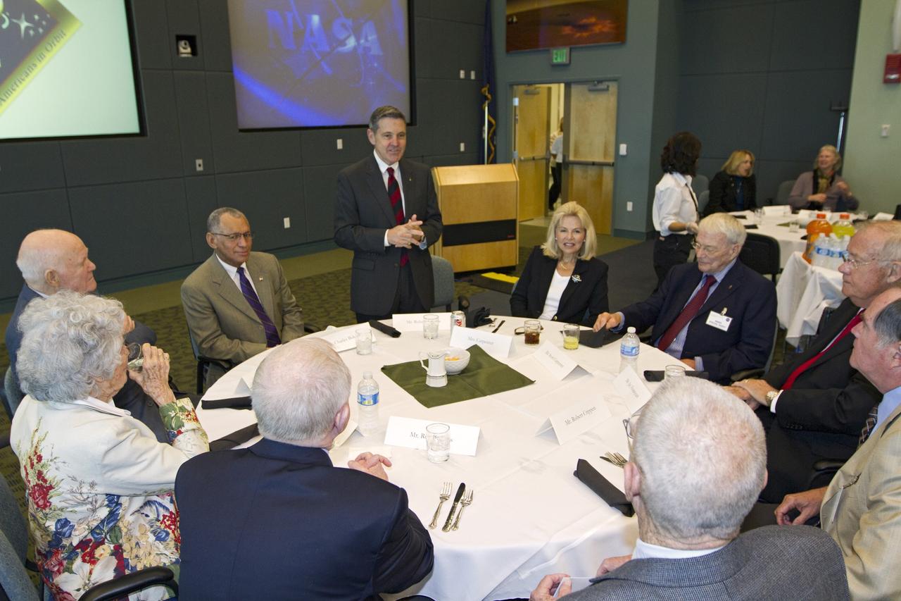 CAPE CANAVERAL, Fla. - Kennedy Space Center Director Bob Cabana, standing, speaks during a luncheon Feb. 17, 2012, celebrating 50 years of Americans in orbit, an era which began with Glenn's Mercury mission MA-6, on Feb. 20, 1962.  Glenn's launch aboard an Atlas rocket took with it the hopes of an entire nation and ushered in a new era of space travel that eventually led to Americans walking on the moon by the end of the 1960s. Glenn soon was followed into orbit by Scott Carpenter, Walter Schirra and Gordon Cooper. Their fellow Mercury astronauts Alan Shepard and Virgil "Gus" Grissom flew earlier suborbital flights. Deke Slayton, a member of NASA's original Mercury 7 astronauts, was grounded by a medical condition until the Apollo-Soyuz Test Project in 1975. Photo credit: NASA/Kim Shiflett