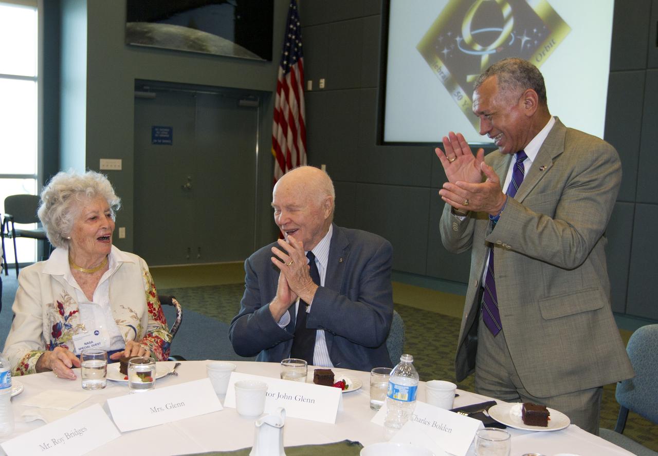 CAPE CANAVERAL, Fla. -Annie Glenn, left, astronaut John Glenn and NASA Administrator Charles Bolden take part in a luncheon Feb. 17, 2012, celebrating 50 years of Americans in orbit, an era which began with Glenn's Mercury mission MA-6, on Feb. 20, 1962.  Glenn's launch aboard an Atlas rocket took with it the hopes of an entire nation and ushered in a new era of space travel that eventually led to Americans walking on the moon by the end of the 1960s. Glenn soon was followed into orbit by Scott Carpenter, Walter Schirra and Gordon Cooper. Their fellow Mercury astronauts Alan Shepard and Virgil "Gus" Grissom flew earlier suborbital flights. Deke Slayton, a member of NASA's original Mercury 7 astronauts, was grounded by a medical condition until the Apollo-Soyuz Test Project in 1975. Photo credit: NASA/Kim Shiflett