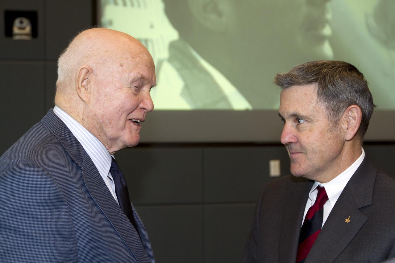 CAPE CANAVERAL, Fla. - Mercury astronaut John Glenn, left, talks with Kennedy Space Center Director Bob Cabana during a luncheon Feb. 17, 2012, celebrating 50 years of Americans in orbit, an era which began with Glenn's Mercury mission MA-6, on Feb. 20, 1962.  Glenn's launch aboard an Atlas rocket took with it the hopes of an entire nation and ushered in a new era of space travel that eventually led to Americans walking on the moon by the end of the 1960s. Glenn soon was followed into orbit by Scott Carpenter, Walter Schirra and Gordon Cooper. Their fellow Mercury astronauts Alan Shepard and Virgil "Gus" Grissom flew earlier suborbital flights. Deke Slayton, a member of NASA's original Mercury 7 astronauts, was grounded by a medical condition until the Apollo-Soyuz Test Project in 1975. Photo credit: NASA/Kim Shiflett
