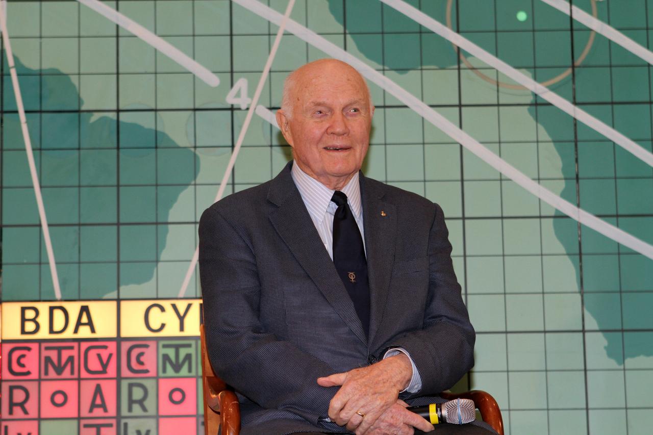 CAPE CANAVERAL, Fla. -- Mercury astronaut John Glenn sits in front of the plot board from the Mercury control center on display at the Kennedy Space Center Visitor Complex in Florida. The astronaut, part of the original class of seven astronauts chosen by NASA, was taking part in a question-and-answer session with the media as part of events celebrating 50 years of Americans in orbit, an era which began with Glenn's Mercury mission MA-6, on Feb. 20, 1962.  Glenn's launch aboard an Atlas rocket took with it the hopes of an entire nation and ushered in a new era of space travel that eventually led to Americans walking on the moon by the end of the 1960s. Glenn soon was followed into orbit by Carpenter, Walter Schirra and Gordon Cooper. Their fellow Mercury astronauts Alan Shepard and Virgil "Gus" Grissom flew earlier suborbital flights. Deke Slayton was grounded by a medical condition until the Apollo-Soyuz Test Project in 1975. Photo credit: NASA/Kim Shiflett