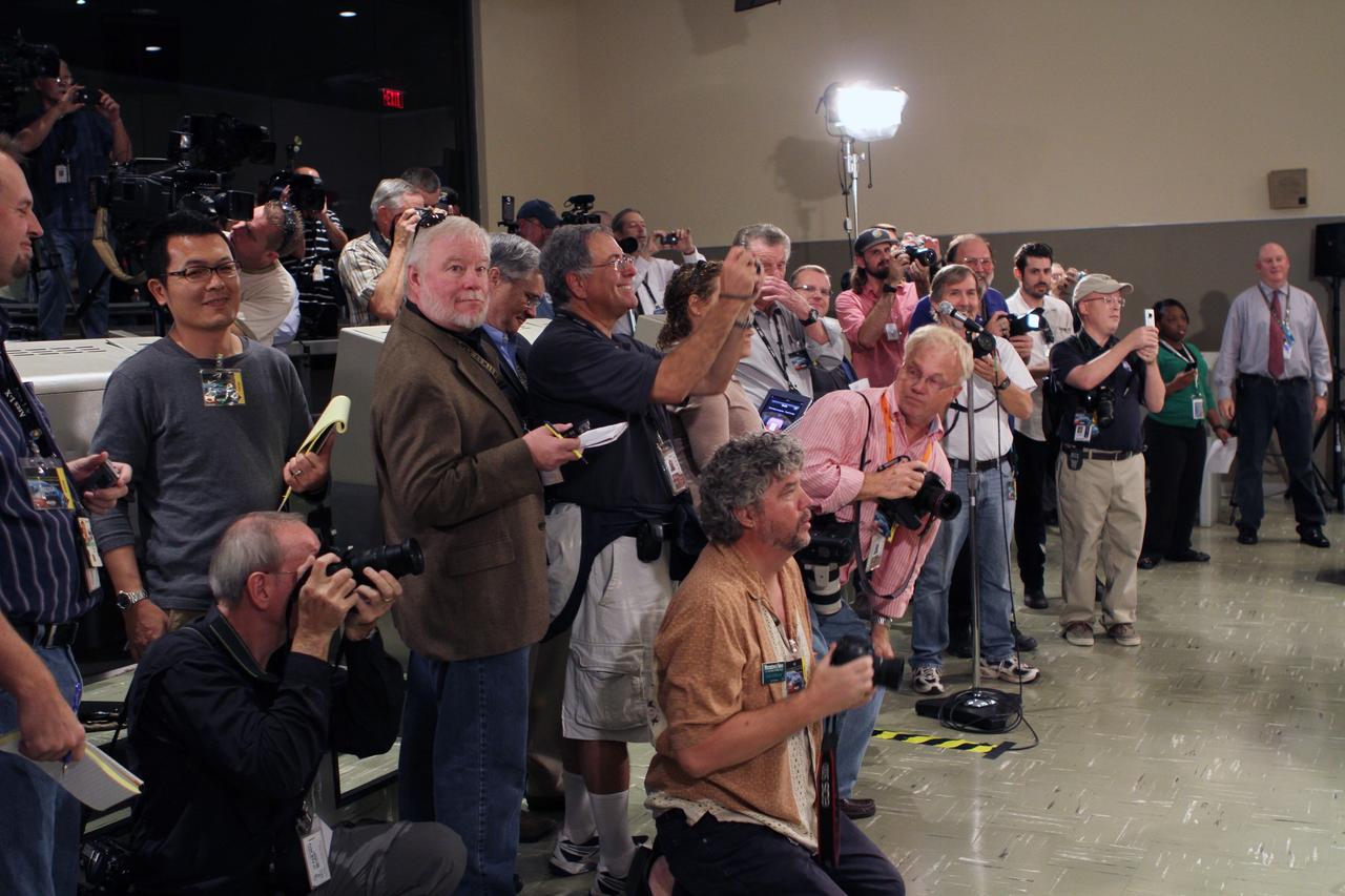 CAPE CANAVERAL, Fla. -- The international news media takes part in a question-and-answer session with Mercury astronauts John Glenn and Scott Carpenter at the Kennedy Space Center Visitor Complex in Florida. The astronauts, part of the original class of seven astronauts chosen by NASA, were taking part in events celebrating 50 years of Americans in orbit, an era which began with John Glenn's Mercury mission MA-6, on Feb. 20, 1962.  Glenn's launch aboard an Atlas rocket took with it the hopes of an entire nation and ushered in a new era of space travel that eventually led to Americans walking on the moon by the end of the 1960s. Glenn soon was followed into orbit by Carpenter, Walter Schirra and Gordon Cooper. Their fellow Mercury astronauts Alan Shepard and Virgil "Gus" Grissom flew earlier suborbital flights. Deke Slayton was grounded by a medical condition until the Apollo-Soyuz Test Project in 1975. Photo credit: NASA/Kim Shiflett