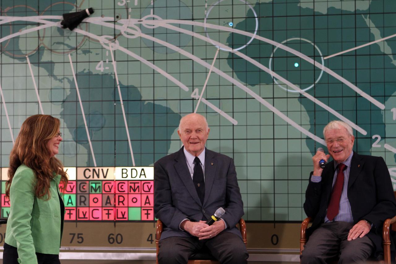 CAPE CANAVERAL, Fla. -- Lisa Malone, left, director of Public Affairs at NASA's Kennedy Space Center in Florida, talks with Mercury astronauts John Glenn, center, and Scott Carpenter in front of the plot board from the Mercury control center on display at the Kennedy Space Center Visitor Complex. The astronauts, part of the original class of seven astronauts chosen by NASA, were taking part in a question-and-answer session with the media as part of events celebrating 50 years of Americans in orbit, an era which began with John Glenn's Mercury mission MA-6, on Feb. 20, 1962.  Glenn's launch aboard an Atlas rocket took with it the hopes of an entire nation and ushered in a new era of space travel that eventually led to Americans walking on the moon by the end of the 1960s. Glenn soon was followed into orbit by Carpenter, Walter Schirra and Gordon Cooper. Their fellow Mercury astronauts Alan Shepard and Virgil "Gus" Grissom flew earlier suborbital flights. Deke Slayton was grounded by a medical condition until the Apollo-Soyuz Test Project in 1975. Photo credit: NASA/Kim Shiflett
