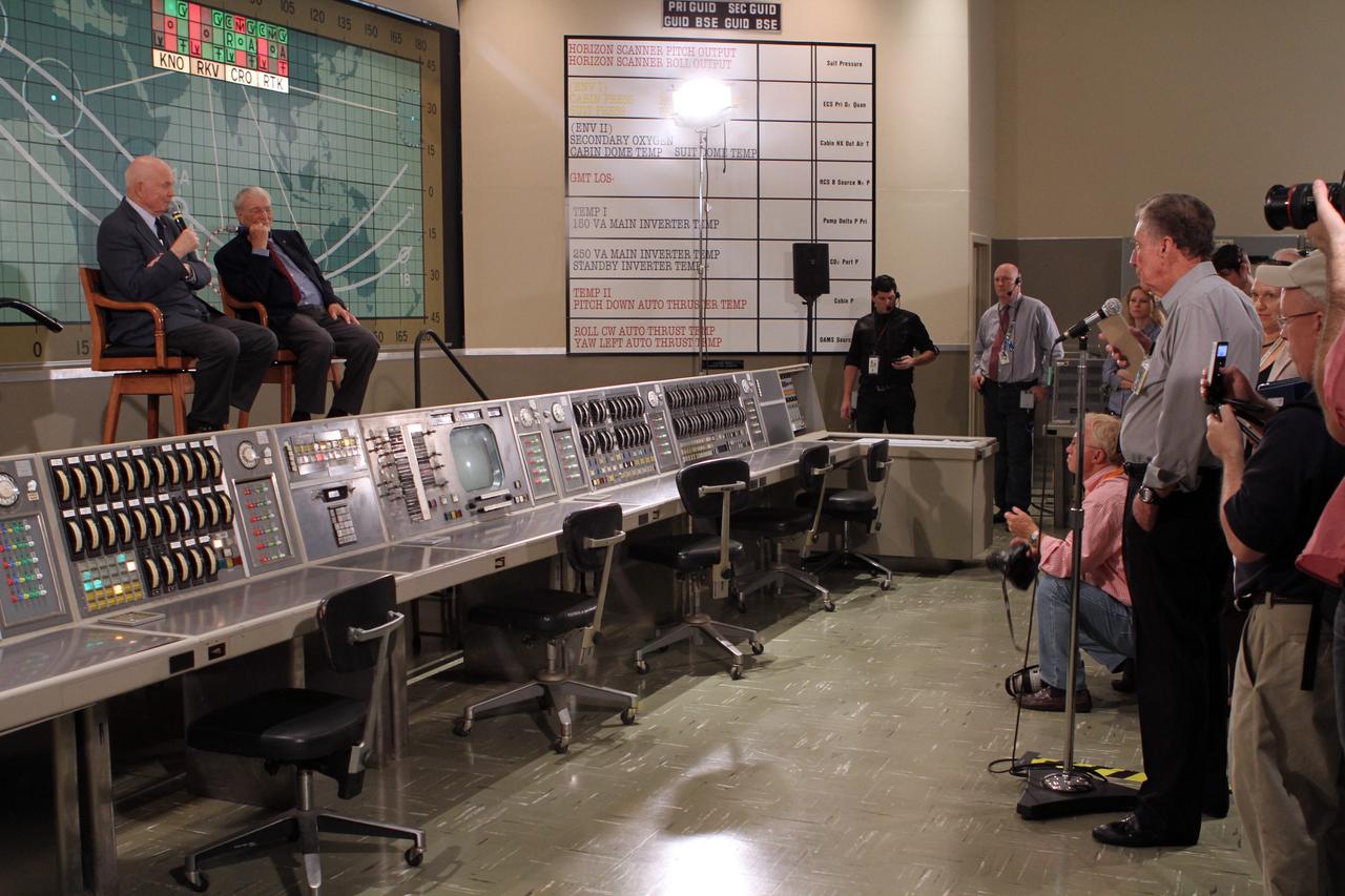 CAPE CANAVERAL, Fla. -- Mercury astronauts John Glenn, left, and Scott Carpenter sit in front of the plot board from the Mercury control center on display at the Kennedy Space Center Visitor Complex. The astronauts, part of the original class of seven astronauts chosen by NASA, were taking part in a question-and-answer session with the media as part of events celebrating 50 years of Americans in orbit, an era which began with John Glenn's Mercury mission MA-6, on Feb. 20, 1962.  Glenn's launch aboard an Atlas rocket took with it the hopes of an entire nation and ushered in a new era of space travel that eventually led to Americans walking on the moon by the end of the 1960s. Glenn soon was followed into orbit by Carpenter, Walter Schirra and Gordon Cooper. Their fellow Mercury astronauts Alan Shepard and Virgil "Gus" Grissom flew earlier suborbital flights. Deke Slayton was grounded by a medical condition until the Apollo-Soyuz Test Project in 1975. Photo credit: NASA/Kim Shiflett