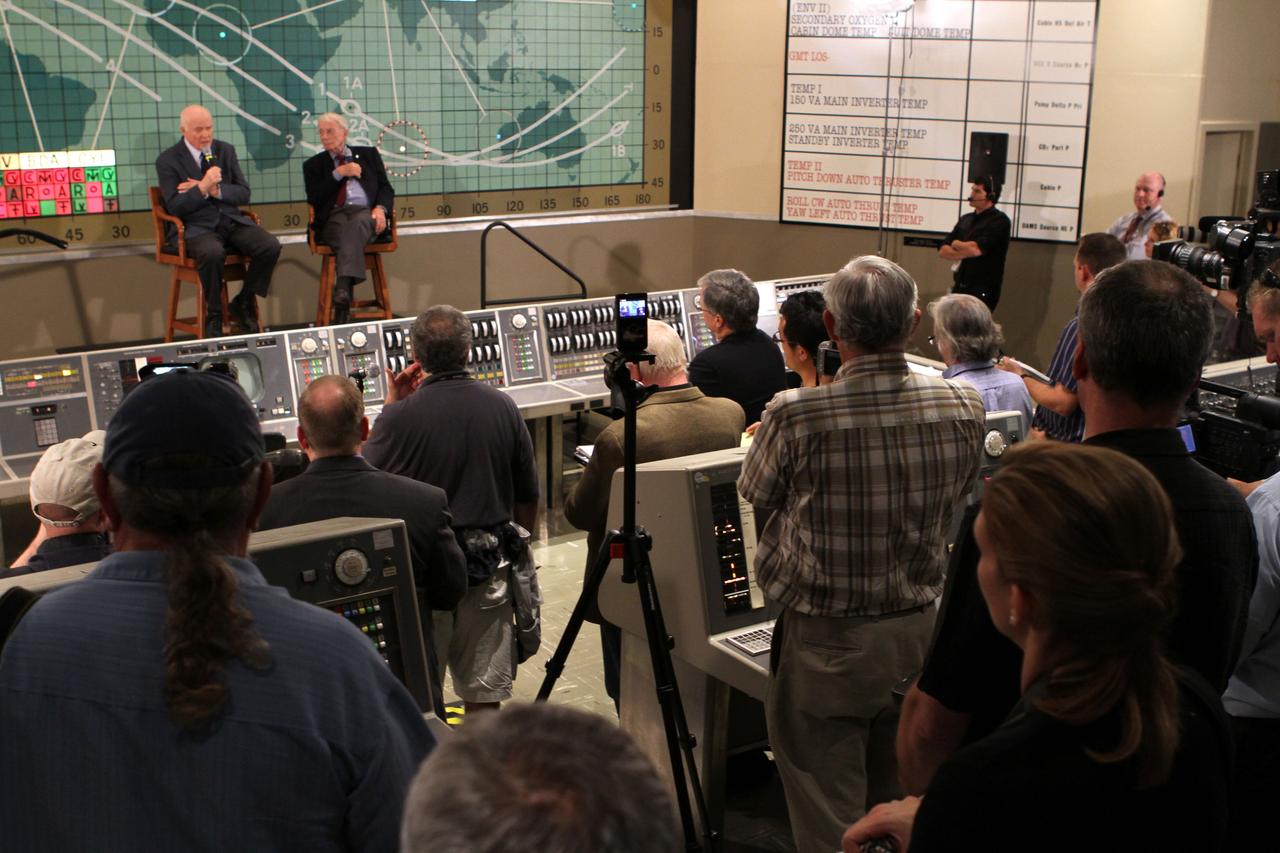 CAPE CANAVERAL, Fla. -- Mercury astronauts John Glenn, left, and Scott Carpenter sit in front of the plot board from the Mercury control center on display at the Kennedy Space Center Visitor Complex. The astronauts, part of the original class of seven astronauts chosen by NASA, were taking part in a question-and-answer session with the media as part of events celebrating 50 years of Americans in orbit, an era which began with John Glenn's Mercury mission MA-6, on Feb. 20, 1962.  Glenn's launch aboard an Atlas rocket took with it the hopes of an entire nation and ushered in a new era of space travel that eventually led to Americans walking on the moon by the end of the 1960s. Glenn soon was followed into orbit by Carpenter, Walter Schirra and Gordon Cooper. Their fellow Mercury astronauts Alan Shepard and Virgil "Gus" Grissom flew earlier suborbital flights. Deke Slayton was grounded by a medical condition until the Apollo-Soyuz Test Project in 1975. Photo credit: NASA/Kim Shiflett