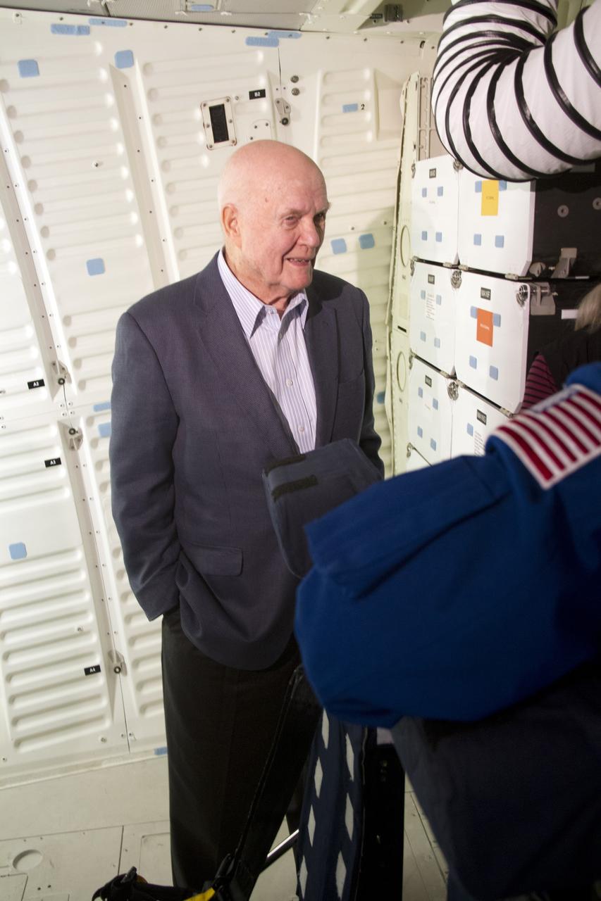CAPE CANAVERAL, Fla. -- John Glenn stands in the middeck of space shuttle Discovery in Orbiter Processing Facility-1 OPF-1 at NASA's Kennedy Space Center in Florida. Glenn is at the space center to mark the 50th anniversary of being the first American astronaut to orbit the Earth inside the NASA Mercury Project's Friendship 7 capsule on Feb. 20, 1962. Glenn later returned to space in October 1998 as a payload specialist aboard Discovery's STS-95 mission.     Glenn's launch aboard an Atlas rocket took with it the hopes of an entire nation and ushered in a new era of space travel that eventually led to Americans walking on the moon by the end of the 1960s. Glenn soon was followed into orbit by Scott Carpenter, Walter Schirra and Gordon Cooper. Their fellow Mercury astronauts Alan Shepard and Virgil "Gus" Grissom flew earlier suborbital flights. Deke Slayton, a member of NASA's original Mercury 7 astronauts, was grounded by a medical condition until the Apollo-Soyuz Test Project in 1975. Shuttle Discovery currently is being prepared for display at Smithsonian’s National Air and Space Museum, Steven F. Udvar-Hazy Center in Chantilly, Va. Photo credit: Cory Huston