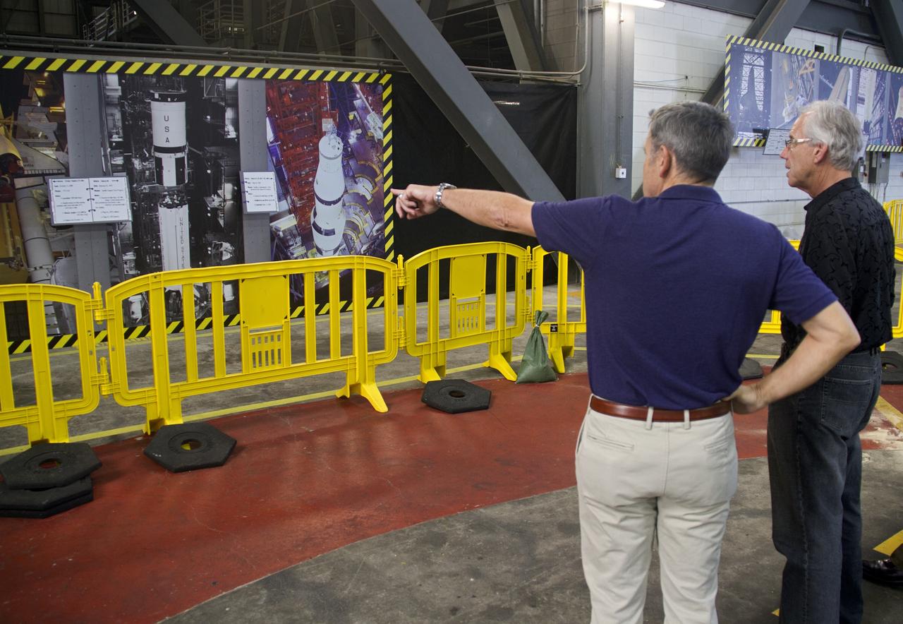 CAPE CANAVERAL, Fla. -- NASA Kennedy Space Center Bob Cabana talks to a guest about the Mercury Project's Atlas rocket in the Vehicle Assembly Building. At the space center in Florida, Cabana is helping John Glenn mark the 50th anniversary of being the first American astronaut to orbit the Earth inside the NASA Mercury Project's Friendship 7 capsule on Feb. 20, 1962. Glenn later returned to space in October 1998 as a payload specialist aboard space shuttle Discovery's STS-95 mission.           Glenn's launch aboard an Atlas rocket took with it the hopes of an entire nation and ushered in a new era of space travel that eventually led to Americans walking on the moon by the end of the 1960s. Glenn soon was followed into orbit by Scott Carpenter, Walter Schirra and Gordon Cooper. Their fellow Mercury astronauts Alan Shepard and Virgil "Gus" Grissom flew earlier suborbital flights. Deke Slayton, a member of NASA's original Mercury 7 astronauts, was grounded by a medical condition until the Apollo-Soyuz Test Project in 1975. Photo credit: Cory Huston