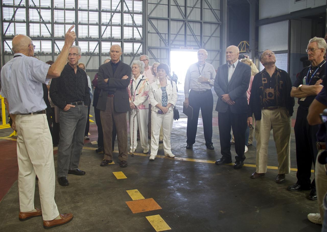 CAPE CANAVERAL, Fla. -- Former space shuttle launch director, Bob Sieck, left, talks to guests in the Vehicle Assembly Building at NASA's Kennedy Space Center in Florida. Sieck is helping John Glenn mark the 50th anniversary of being the first American astronaut to orbit the Earth inside the NASA Mercury Project's Friendship 7 capsule on Feb. 20, 1962. Glenn later returned to space in October 1998 as a payload specialist aboard space shuttle Discovery's STS-95 mission.       Glenn's launch aboard an Atlas rocket took with it the hopes of an entire nation and ushered in a new era of space travel that eventually led to Americans walking on the moon by the end of the 1960s. Glenn soon was followed into orbit by Scott Carpenter, Walter Schirra and Gordon Cooper. Their fellow Mercury astronauts Alan Shepard and Virgil "Gus" Grissom flew earlier suborbital flights. Deke Slayton, a member of NASA's original Mercury 7 astronauts, was grounded by a medical condition until the Apollo-Soyuz Test Project in 1975. Photo credit: Cory Huston