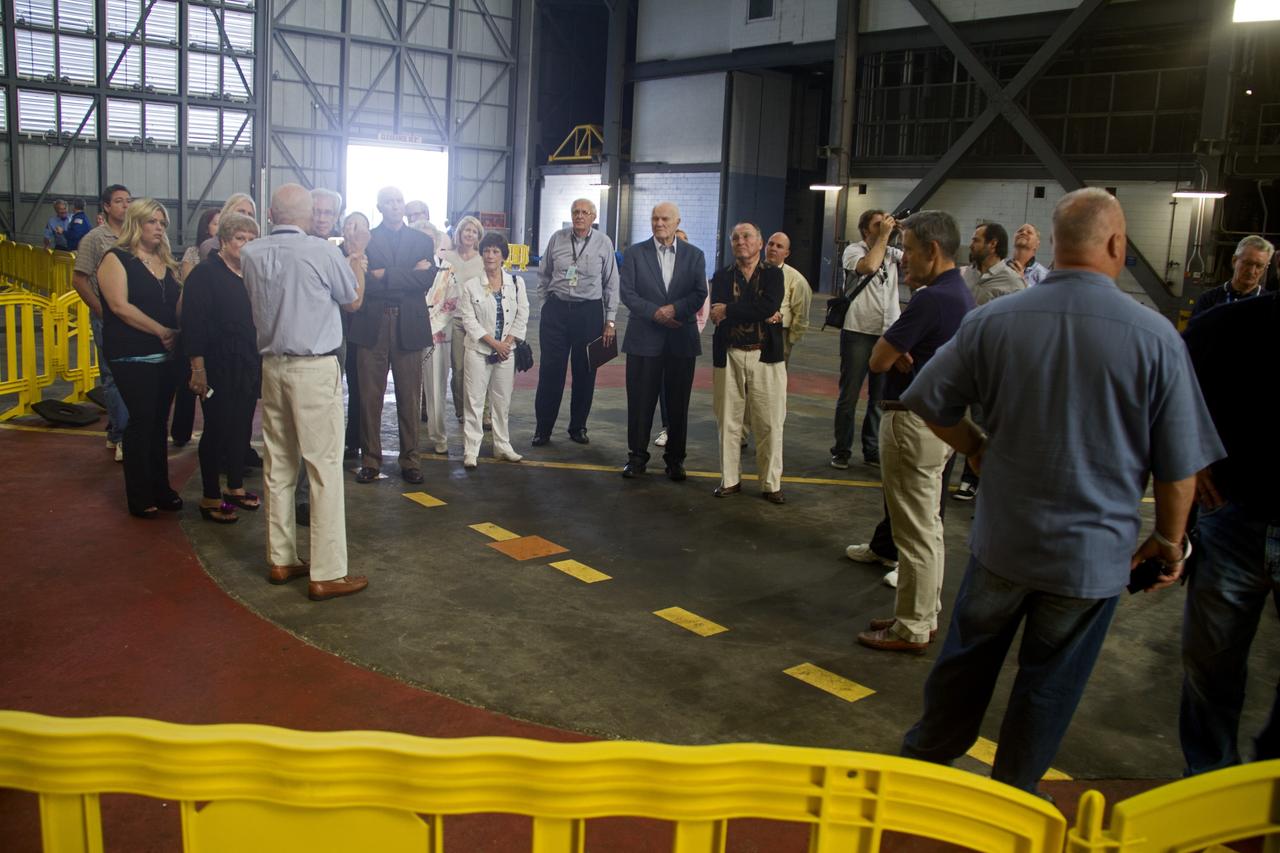 CAPE CANAVERAL, Fla. -- Former space shuttle launch director, Bob Sieck, left, talks to guests in the Vehicle Assembly Building at NASA's Kennedy Space Center in Florida. Sieck is helping John Glenn mark the 50th anniversary of being the first American astronaut to orbit the Earth inside the NASA Mercury Project's Friendship 7 capsule on Feb. 20, 1962. Glenn later returned to space in October 1998 as a payload specialist aboard space shuttle Discovery's STS-95 mission.     Glenn's launch aboard an Atlas rocket took with it the hopes of an entire nation and ushered in a new era of space travel that eventually led to Americans walking on the moon by the end of the 1960s. Glenn soon was followed into orbit by Scott Carpenter, Walter Schirra and Gordon Cooper. Their fellow Mercury astronauts Alan Shepard and Virgil "Gus" Grissom flew earlier suborbital flights. Deke Slayton, a member of NASA's original Mercury 7 astronauts, was grounded by a medical condition until the Apollo-Soyuz Test Project in 1975. Photo credit: Cory Huston