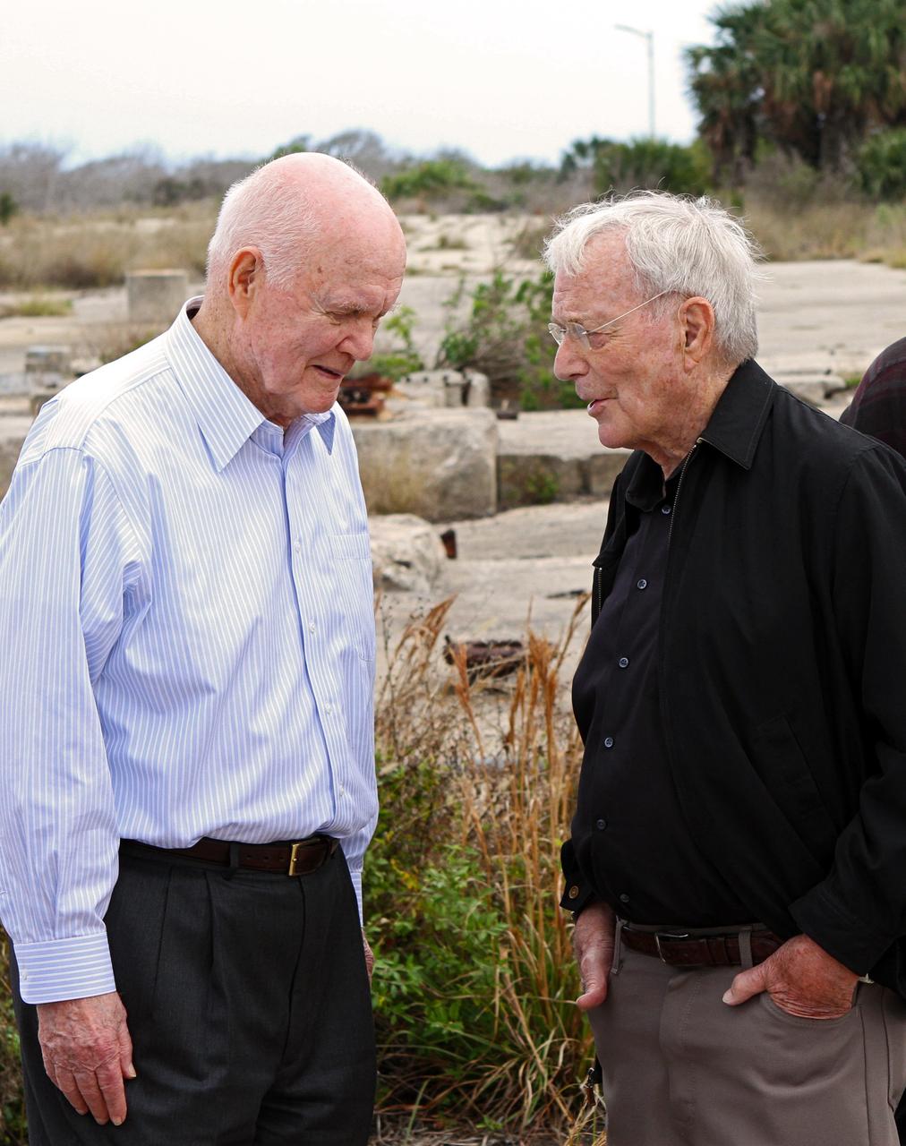 CAPE CANAVERAL, Fla. -- Mercury astronauts John Glenn, left and Scott Carpenter look around at the dismantled Complex 14 at Cape Canaveral Air Force Station in Florida. Glenn and Carpenter launched from the pad on Atlas rockets inside Mercury capsules in 1962. The two astronauts, part of the original class of seven astronauts chosen by NASA, were taking part in events celebrating 50 years of Americans in orbit, an era which began with Glenn's Mercury mission MA-6, on Feb. 20, 1962.  Glenn's launch aboard an Atlas rocket took with it the hopes of an entire nation and ushered in a new era of space travel that eventually led to Americans walking on the moon by the end of the 1960s. Glenn soon was followed into orbit by Carpenter, Walter Schirra and Gordon Cooper. Their fellow Mercury astronauts Alan Shepard and Virgil "Gus" Grissom flew earlier suborbital flights. Deke Slayton was grounded by a medical condition until the Apollo-Soyuz Test Project in 1975. Photo credit: NASA/Cory Huston
