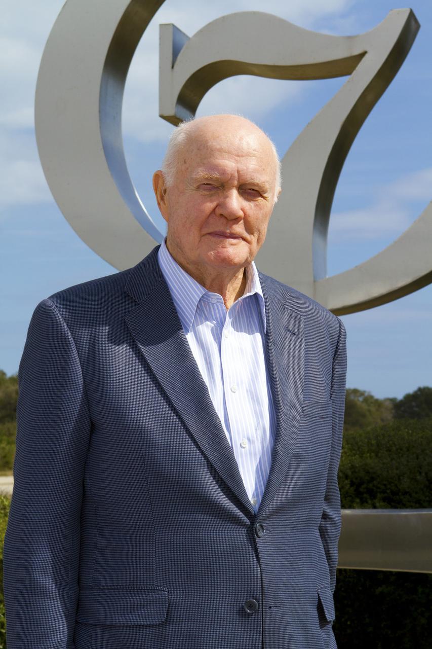 CAPE CANAVERAL, Fla. -- Mercury astronaut John Glenn poses for a photo in front of the Project Mercury monument at Launch Complex-14 LC-14 at Cape Canaveral Air Force Station in Florida. During events at the Cape and NASA's Kennedy Space Center, Glenn is marking the 50th anniversary of being the first American astronaut to orbit the Earth inside the Friendship 7 capsule on Feb. 20, 1962.     Glenn's launch aboard an Atlas rocket took with it the hopes of an entire nation and ushered in a new era of space travel that eventually led to Americans walking on the moon by the end of the 1960s. Glenn soon was followed into orbit by Scott Carpenter, Walter Schirra and Gordon Cooper. Their fellow Mercury astronauts Alan Shepard and Virgil "Gus" Grissom flew earlier suborbital flights. Deke Slayton, a member of NASA's original Mercury 7 astronauts, was grounded by a medical condition until the Apollo-Soyuz Test Project in 1975. Photo credit: Kim Shiflett