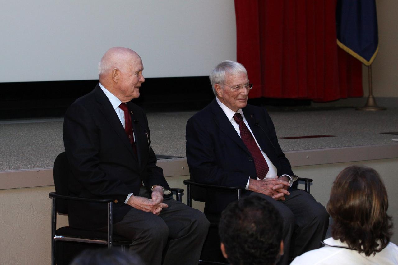 CAPE CANAVERAL, Fla. -- Mercury astronauts, John Glenn, left, and Scott Carpenter, talk to Mercury Project workers and other guests in the Astronaut Encounter Theater at the Kennedy Space Center Visitor Complex in Florida. The pair participated in 50th anniversary events at the launch site of Glenn's first orbital flight aboard NASA's Friendship 7 capsule, which launched Feb. 20, 1962, aboard an Atlas rocket.               Glenn's launch aboard an Atlas rocket took with it the hopes of an entire nation and ushered in a new era of space travel that eventually led to Americans walking on the moon by the end of the 1960s. Glenn soon was followed into orbit by Carpenter, Walter Schirra and Gordon Cooper. Their fellow Mercury astronauts Alan Shepard and Virgil "Gus" Grissom flew earlier suborbital flights. Deke Slayton, a member of NASA's original Mercury 7 astronauts, was grounded by a medical condition until the Apollo-Soyuz Test Project in 1975. Photo credit: Kim Shiflett