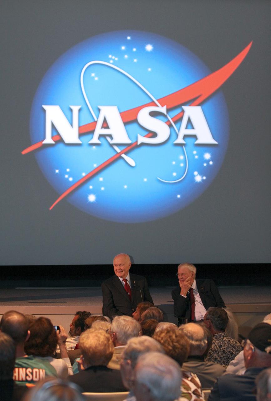 CAPE CANAVERAL, Fla. -- Mercury astronauts, John Glenn, left, and Scott Carpenter, talk to Mercury Project workers and other guests in the Astronaut Encounter Theater at the Kennedy Space Center Visitor Complex in Florida. The pair participated in 50th anniversary events at the launch site of Glenn's first orbital flight aboard NASA's Friendship 7 capsule, which launched Feb. 20, 1962, aboard an Atlas rocket.           Glenn's launch aboard an Atlas rocket took with it the hopes of an entire nation and ushered in a new era of space travel that eventually led to Americans walking on the moon by the end of the 1960s. Glenn soon was followed into orbit by Carpenter, Walter Schirra and Gordon Cooper. Their fellow Mercury astronauts Alan Shepard and Virgil "Gus" Grissom flew earlier suborbital flights. Deke Slayton, a member of NASA's original Mercury 7 astronauts, was grounded by a medical condition until the Apollo-Soyuz Test Project in 1975. Photo credit: Kim Shiflett