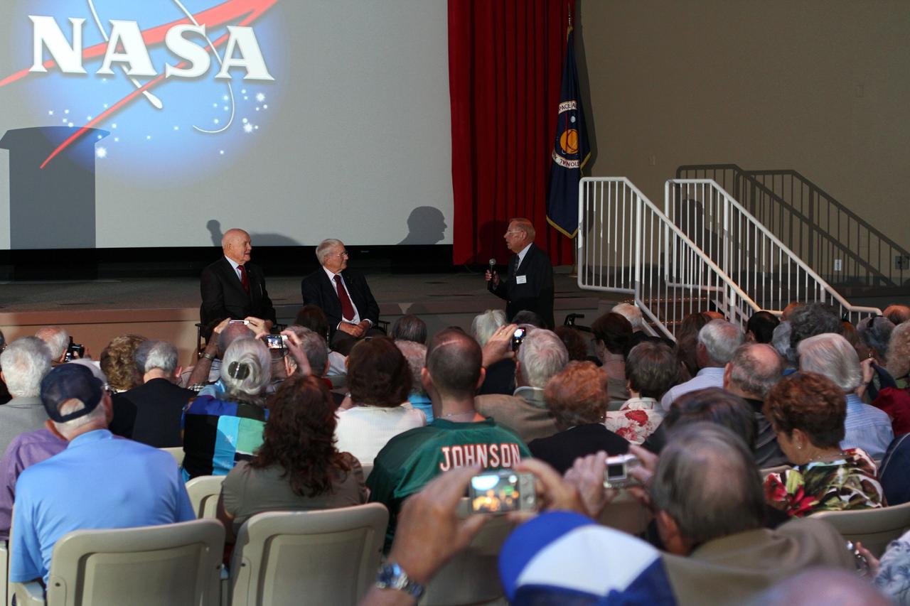 CAPE CANAVERAL, Fla. -- Mercury astronauts, John Glenn, left, and Scott Carpenter, talk to Mercury Project workers and other guests in the Astronaut Encounter Theater at the Kennedy Space Center Visitor Complex in Florida. The pair participated in 50th anniversary events at the launch site of Glenn's first orbital flight aboard NASA's Friendship 7 capsule, which launched Feb. 20, 1962, aboard an Atlas rocket. At right, is Jack King, who was chief of Kennedy's Public Information Office during Project Mercury.      Glenn's launch aboard an Atlas rocket took with it the hopes of an entire nation and ushered in a new era of space travel that eventually led to Americans walking on the moon by the end of the 1960s. Glenn soon was followed into orbit by Carpenter, Walter Schirra and Gordon Cooper. Their fellow Mercury astronauts Alan Shepard and Virgil "Gus" Grissom flew earlier suborbital flights. Deke Slayton, a member of NASA's original Mercury 7 astronauts, was grounded by a medical condition until the Apollo-Soyuz Test Project in 1975. Photo credit: Kim Shiflett