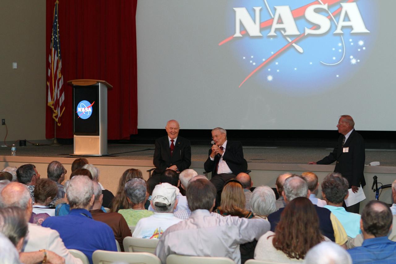 CAPE CANAVERAL, Fla. -- Mercury astronauts, John Glenn, left, and Scott Carpenter, talk to Mercury Project workers and other guests in the Astronaut Encounter Theater at the Kennedy Space Center Visitor Complex in Florida. The pair participated in 50th anniversary events at the launch site of Glenn's first orbital flight aboard NASA's Friendship 7 capsule, which launched Feb. 20, 1962, aboard an Atlas rocket. At right, is Jack King, who was chief of Kennedy's Public Information Office during Project Mercury.    Glenn's launch aboard an Atlas rocket took with it the hopes of an entire nation and ushered in a new era of space travel that eventually led to Americans walking on the moon by the end of the 1960s. Glenn soon was followed into orbit by Carpenter, Walter Schirra and Gordon Cooper. Their fellow Mercury astronauts Alan Shepard and Virgil "Gus" Grissom flew earlier suborbital flights. Deke Slayton, a member of NASA's original Mercury 7 astronauts, was grounded by a medical condition until the Apollo-Soyuz Test Project in 1975. Photo credit: Kim Shiflett