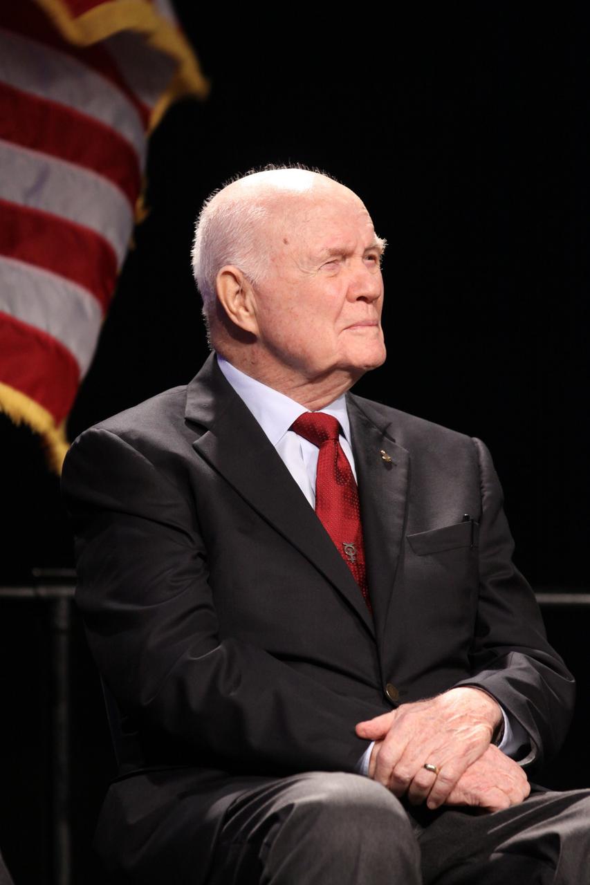 CAPE CANAVERAL, Fla. -- Mercury astronaut John Glenn listens to remarks during the "On Shoulders of Giants" program celebrating 50 years of Americans in orbit, an era which began with Glenn's MA-6 mission on Feb. 20, 1962. The event was conducted in the Rocket Garden at the Kennedy Space Center Visitor Complex in Florida a few miles from the launch pad where Glenn and Scott Carpenter took flight in Mercury spacecraft.  Glenn's launch aboard an Atlas rocket took with it the hopes of an entire nation and ushered in a new era of space travel that eventually led to Americans walking on the moon by the end of the 1960s. Glenn soon was followed into orbit by Scott Carpenter, Walter Schirra and Gordon Cooper. Their fellow Mercury astronauts Alan Shepard and Virgil "Gus" Grissom flew earlier suborbital flights. Deke Slayton, a member of NASA's original Mercury 7 astronauts, was grounded by a medical condition until the Apollo-Soyuz Test Project in 1975. Photo credit: Kim Shiflett