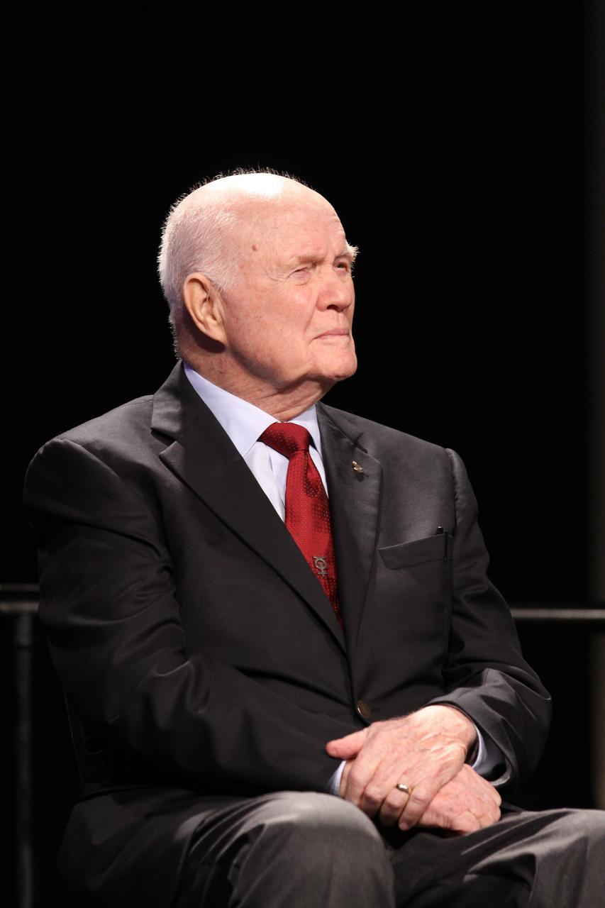 CAPE CANAVERAL, Fla. --Mercury astronaut John Glenn listens to remarks during the "On Shoulders of Giants" program celebrating 50 years of Americans in orbit, an era which began with Glenn's MA-6 mission on Feb. 20, 1962. The event was conducted in the Rocket Garden at the Kennedy Space Center Visitor Complex in Florida a few miles from the launch pad where Glenn and Scott Carpenter took flight in Mercury spacecraft.  Glenn's launch aboard an Atlas rocket took with it the hopes of an entire nation and ushered in a new era of space travel that eventually led to Americans walking on the moon by the end of the 1960s. Glenn soon was followed into orbit by Scott Carpenter, Walter Schirra and Gordon Cooper. Their fellow Mercury astronauts Alan Shepard and Virgil "Gus" Grissom flew earlier suborbital flights. Deke Slayton, a member of NASA's original Mercury 7 astronauts, was grounded by a medical condition until the Apollo-Soyuz Test Project in 1975. Photo credit: Kim Shiflett