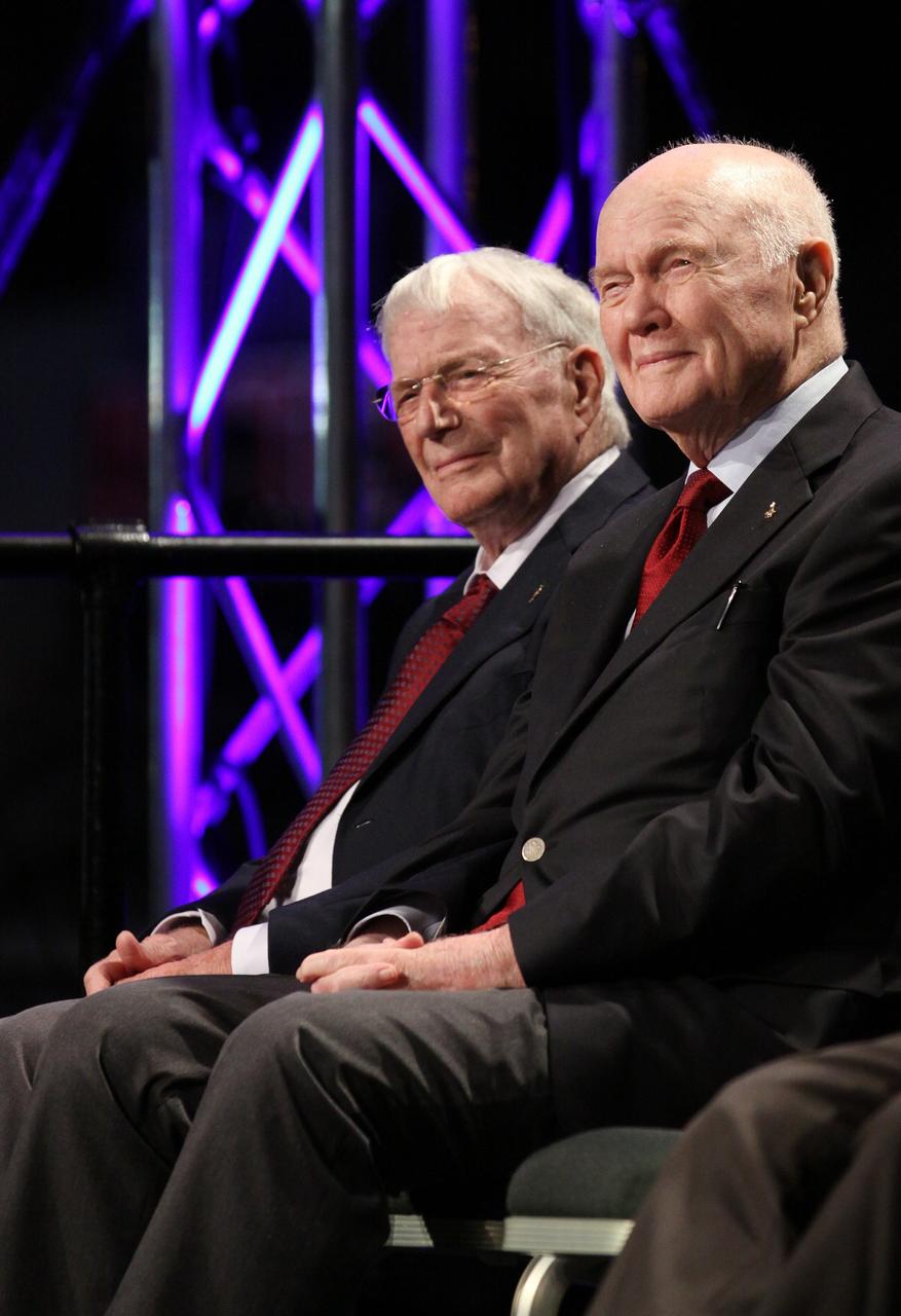 CAPE CANAVERAL, Fla. -- Mercury astronauts Scott Carpenter, left, and John Glenn listen to remarks during the "On Shoulders of Giants" program celebrating 50 years of Americans in orbit, an era which began with Glenn's MA-6 mission on Feb. 20, 1962. The event was conducted in the Rocket Garden at the Kennedy Space Center Visitor Complex in Florida a few miles from the launch pad where Glenn and Carpenter took flight in Mercury spacecraft.  Glenn's launch aboard an Atlas rocket took with it the hopes of an entire nation and ushered in a new era of space travel that eventually led to Americans walking on the moon by the end of the 1960s. Glenn soon was followed into orbit by Carpenter, Walter Schirra and Gordon Cooper. Their fellow Mercury astronauts Alan Shepard and Virgil "Gus" Grissom flew earlier suborbital flights. Deke Slayton, a member of NASA's original Mercury 7 astronauts, was grounded by a medical condition until the Apollo-Soyuz Test Project in 1975. Photo credit: Kim Shiflett