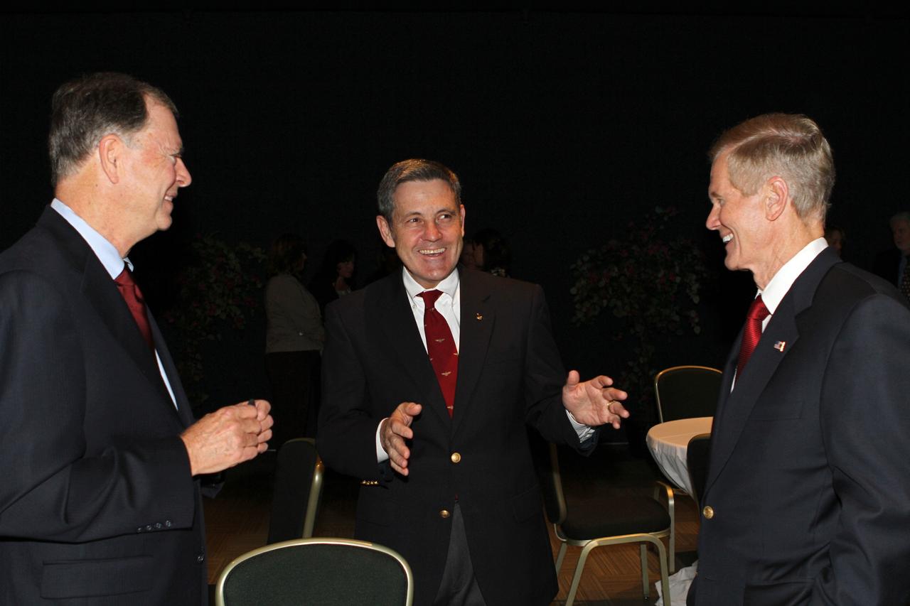 CAPE CANAVERAL, Fla. -- Kennedy Space Center Director Bob Cabana, center, talks with U.S. Rep. Bill Posey, left and U.S. Sen. Bill Nelson following the "On Shoulders of Giants" program celebrating 50 years of Americans in orbit, an era which began with Glenn's MA-6 mission on Feb. 20, 1962. The event was conducted in the Rocket Garden at the Kennedy Space Center Visitor Complex in Florida a few miles from the launch pad where Glenn and Scott Carpenter took flight in Mercury spacecraft.  Glenn's launch aboard an Atlas rocket took with it the hopes of an entire nation and ushered in a new era of space travel that eventually led to Americans walking on the moon by the end of the 1960s. Glenn soon was followed into orbit by Scott Carpenter, Walter Schirra and Gordon Cooper. Their fellow Mercury astronauts Alan Shepard and Virgil "Gus" Grissom flew earlier suborbital flights. Deke Slayton, a member of NASA's original Mercury 7 astronauts, was grounded by a medical condition until the Apollo-Soyuz Test Project in 1975. Photo credit: Kim Shiflett