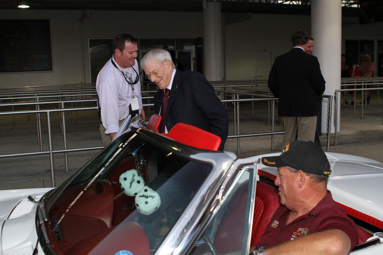 CAPE CANAVERAL, Fla. -- Mercury astronaut Scott Carpenter, center, prepares to ride in the Corvette parade following the "On Shoulders of Giants" program celebrating 50 years of Americans in orbit, an era which began with Glenn's MA-6 mission on Feb. 20, 1962. The event was conducted in the Rocket Garden at the Kennedy Space Center Visitor Complex in Florida a few miles from the launch pad where Glenn and Carpenter took flight in Mercury spacecraft.  Glenn's launch aboard an Atlas rocket took with it the hopes of an entire nation and ushered in a new era of space travel that eventually led to Americans walking on the moon by the end of the 1960s. Glenn soon was followed into orbit by Scott Carpenter, Walter Schirra and Gordon Cooper. Their fellow Mercury astronauts Alan Shepard and Virgil "Gus" Grissom flew earlier suborbital flights. Deke Slayton, a member of NASA's original Mercury 7 astronauts, was grounded by a medical condition until the Apollo-Soyuz Test Project in 1975. Photo credit: Kim Shiflett