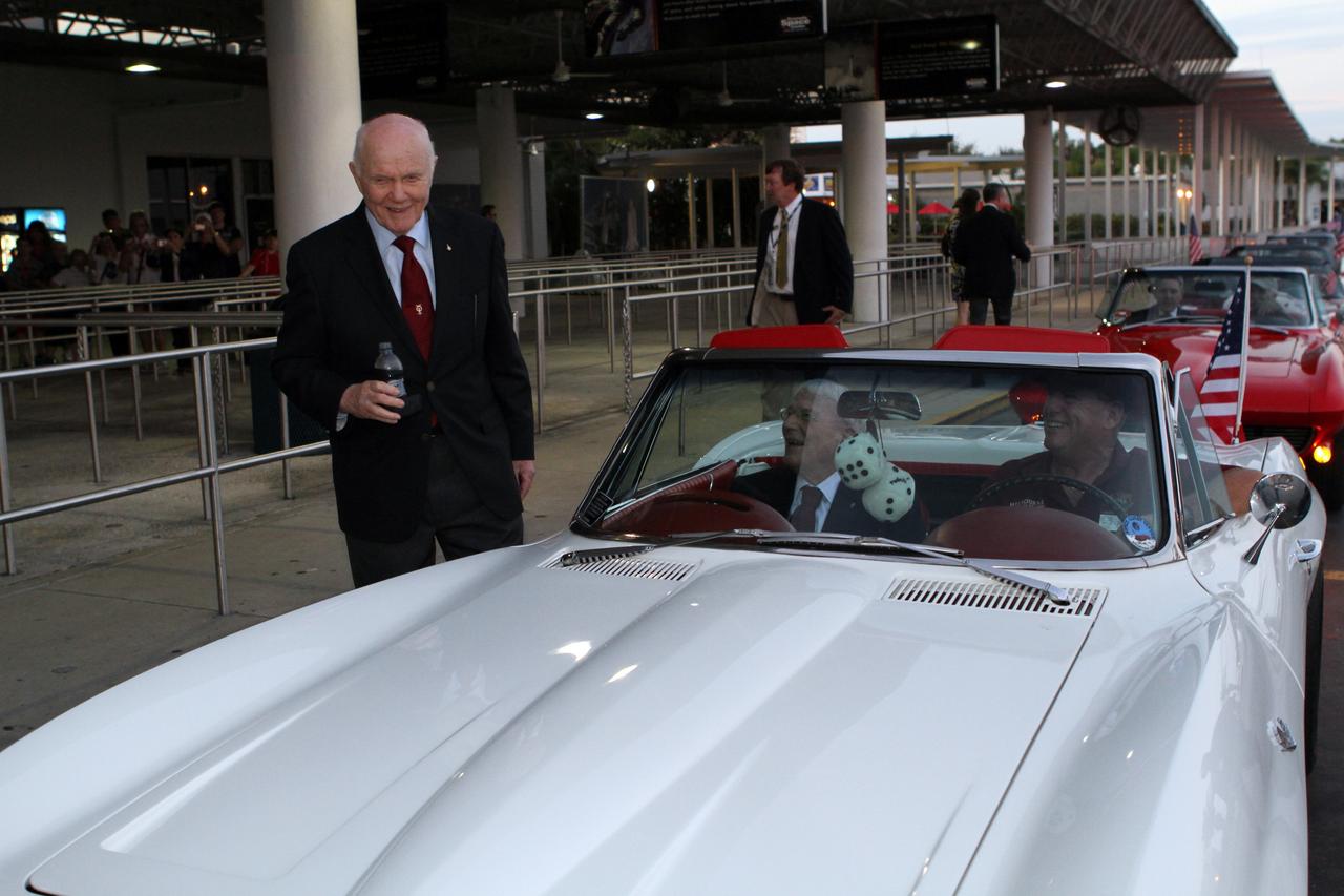 CAPE CANAVERAL, Fla. -- Mercury astronaut John Glenn, left, talks with fellow Mercury astronaut Scott Carpenter before they ride in the Corvette parade following the "On Shoulders of Giants" program celebrating 50 years of Americans in orbit, an era which began with Glenn's MA-6 mission on Feb. 20, 1962. The event was conducted in the Rocket Garden at the Kennedy Space Center Visitor Complex in Florida a few miles from the launch pad where Glenn and Carpenter took flight in Mercury spacecraft.  Glenn's launch aboard an Atlas rocket took with it the hopes of an entire nation and ushered in a new era of space travel that eventually led to Americans walking on the moon by the end of the 1960s. Glenn soon was followed into orbit by Scott Carpenter, Walter Schirra and Gordon Cooper. Their fellow Mercury astronauts Alan Shepard and Virgil "Gus" Grissom flew earlier suborbital flights. Deke Slayton, a member of NASA's original Mercury 7 astronauts, was grounded by a medical condition until the Apollo-Soyuz Test Project in 1975. Photo credit: Kim Shiflett