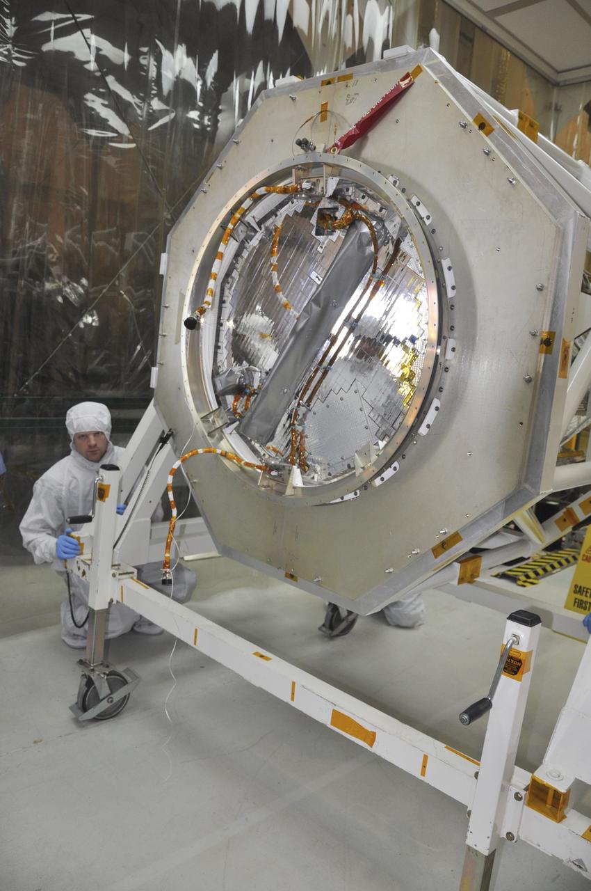 VANDENBERG AIR FORCE BASE, Calif. -- At Vandenberg Air Force Base's processing facility in California, this separation ring, installed on the aft end of NASA's Nuclear Spectroscopic Telescope Array, or NuSTAR, is the mating interface between the spacecraft and the upper stage of the Orbital Sciences Pegasus XL rocket which will place it in orbit.  Behind the ring is part of the turnover rotation fixture, the C-plate, which protects the spacecraft during mating operations. The conjoining of the spacecraft with the rocket is a major milestone in prelaunch preparations.          After processing of the rocket and spacecraft are complete, they will be flown on Orbital's L-1011 carrier aircraft from Vandenberg to the Ronald Reagan Ballistic Missile Defense Test Site on the Pacific Ocean’s Kwajalein Atoll for launch. The high-energy x-ray telescope will conduct a census of black holes, map radioactive material in young supernovae remnants, and study the origins of cosmic rays and the extreme physics around collapsed stars. For more information, visit http://www.nasa.gov/nustar.  Photo credit: NASA/Randy Beaudoin, VAFB