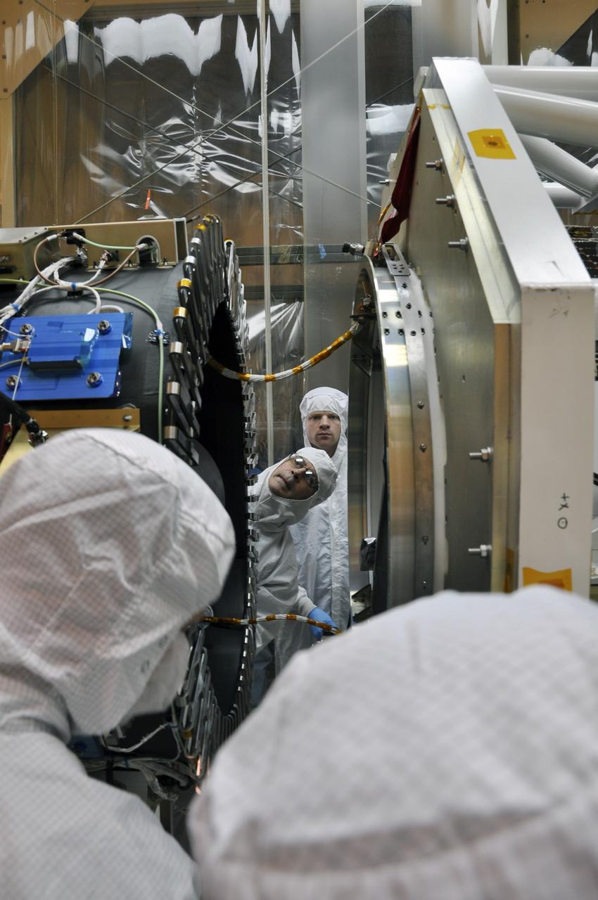 VANDENBERG AIR FORCE BASE, Calif. -- At Vandenberg Air Force Base's processing facility in California, the separation ring on the aft end of NASA's Nuclear Spectroscopic Telescope Array, or NuSTAR, , at right, inches its way toward the third stage of an Orbital Sciences Pegasus XL rocket under the watchful eye of a member of the Orbital Sciences technical team. The spacecraft is being mated to the rocket, a major milestone in prelaunch preparations.        After processing of the rocket and spacecraft are complete, they will be flown on Orbital's L-1011 carrier aircraft from Vandenberg to the Ronald Reagan Ballistic Missile Defense Test Site on the Pacific Ocean’s Kwajalein Atoll for launch. The high-energy x-ray telescope will conduct a census of black holes, map radioactive material in young supernovae remnants, and study the origins of cosmic rays and the extreme physics around collapsed stars. For more information, visit http://www.nasa.gov/nustar.  Photo credit: NASA/Randy Beaudoin, VAFB