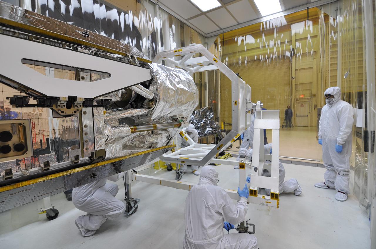 VANDENBERG AIR FORCE BASE, Calif. – Inside an environmental enclosure at Vandenberg Air Force Base's processing facility in California, the turnover rotation fixture has been removed from around NASA's Nuclear Spectroscopic Telescope Array, or NuSTAR, following its mating to an Orbital Sciences Pegasus XL rocket.  The turnover rotation fixture was used to rotate the spacecraft into a horizontal position and supported it during mating operations.  The uniting of the spacecraft with the rocket is a major milestone in prelaunch preparations.          After processing of the rocket and spacecraft are complete, they will be flown on Orbital's L-1011 carrier aircraft from Vandenberg to the Ronald Reagan Ballistic Missile Defense Test Site on the Pacific Ocean’s Kwajalein Atoll for launch. The high-energy x-ray telescope will conduct a census of black holes, map radioactive material in young supernovae remnants, and study the origins of cosmic rays and the extreme physics around collapsed stars. For more information, visit http://www.nasa.gov/nustar.  Photo credit: NASA/Randy Beaudoin, VAFB