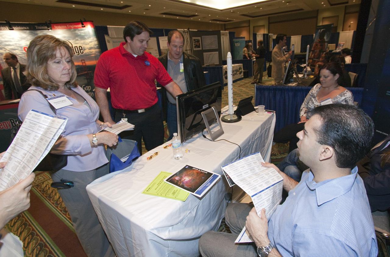 ORLANDO, Fla. -- Representatives from NASA’s Launch Services Program, located at Kennedy Space Center in Florida, provide information on the program to participants in NASA’s Project Management Challenge 2012.    PM Challenge 2012 was held at the Caribe Royale Hotel and Convention Center in Orlando, Fla., on February 22-23, to provide a forum for all stakeholders in the project management community to meet and share stories, lessons learned and new uses of technology in the industry. The PM Challenge is sponsored by NASA's Office of the Chief Engineer. For additional information, visit http://www.nasa.gov/offices/oce/pmchallenge/index.html.  Photo credit: NASA/Jim Grossmann