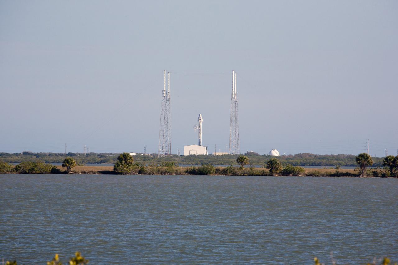 CAPE CANAVERAL, Fla. – The Space Exploration Technologies Corp. SpaceX Falcon 9 rocket with Dragon capsule attached on top sits fully fueled on Space Launch Complex-40 at Cape Canaveral Air Force Station in Florida during a launch dress rehearsal for the company’s next demonstration test flight for NASA’s Commercial Orbital Transportation Services-2 COTS-2) program.    SpaceX is one of two companies under contract with NASA to take cargo to the International Space Station. NASA is working with SpaceX to combine its last two demonstration flights, and if approved, the Falcon 9 would launch the Dragon capsule to the orbiting laboratory for a docking within the next several months. Photo credit: NASA/Gianni Woods