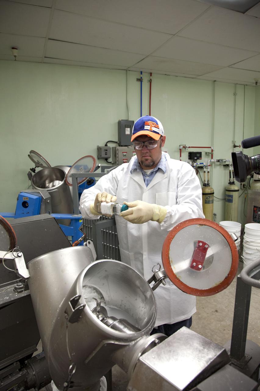 CAPE CANAVERAL, Fla. -- Chris Keeling, a United Space Alliance technician at NASA's Kennedy Space Center in Florida, manufactures the heat shield tiles that will be installed to the backshell of the Orion Multi-Purpose Crew Vehicle's Exploration Flight Test EFT-1 capsule. The work to manufacture and inspect the tiles is taking place in Kennedy's Thermal Protection System Facility. EFT-1 will be used during Orion's first test flight in space. For more information, visit www.nasa.gov/orion. Photo credit: Frankie Martin