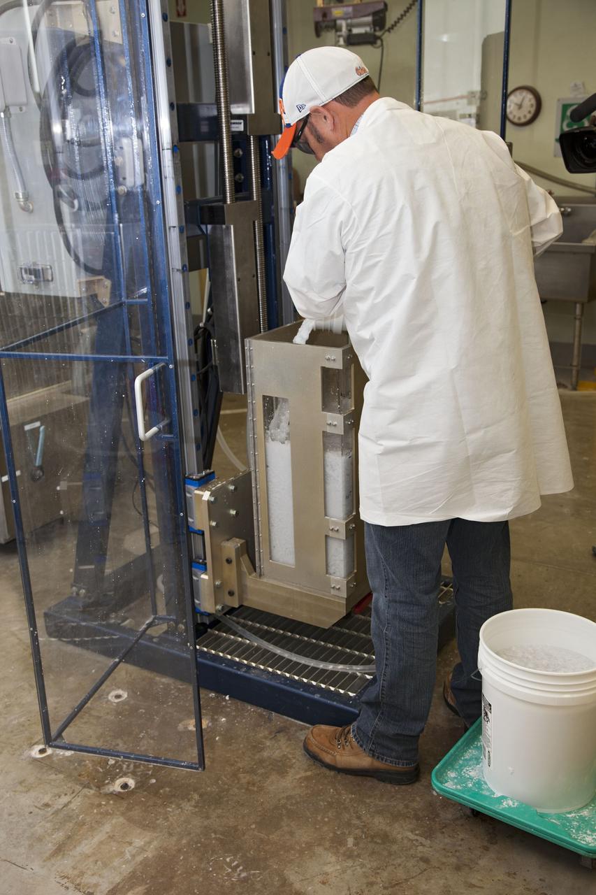 CAPE CANAVERAL, Fla. -- Chris Keeling, a United Space Alliance technician at NASA's Kennedy Space Center in Florida, manufactures the heat shield tiles that will be installed to the backshell of the Orion Multi-Purpose Crew Vehicle's Exploration Flight Test EFT-1 capsule. The work to manufacture and inspect the tiles is taking place in Kennedy's Thermal Protection System Facility. EFT-1 will be used during Orion's first test flight in space. For more information, visit www.nasa.gov/orion. Photo credit: Frankie Martin