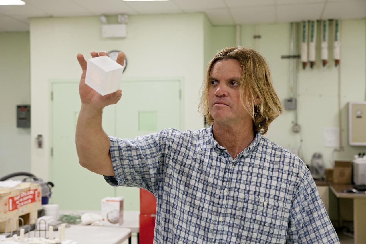 CAPE CANAVERAL, Fla. -- Tim Wright, a United Space Alliance engineering manager at NASA's Kennedy Space Center in Florida, explains the properties of the heat shield tiles that will be installed to the backshell of the Orion Multi-Purpose Crew Vehicle's Exploration Flight Test EFT-1 capsule. The work to manufacture and inspect the tiles is taking place in Kennedy's Thermal Protection System Facility. EFT-1 will be used during Orion's first test flight in space. For more information, visit www.nasa.gov/orion. Photo credit: Frankie Martin