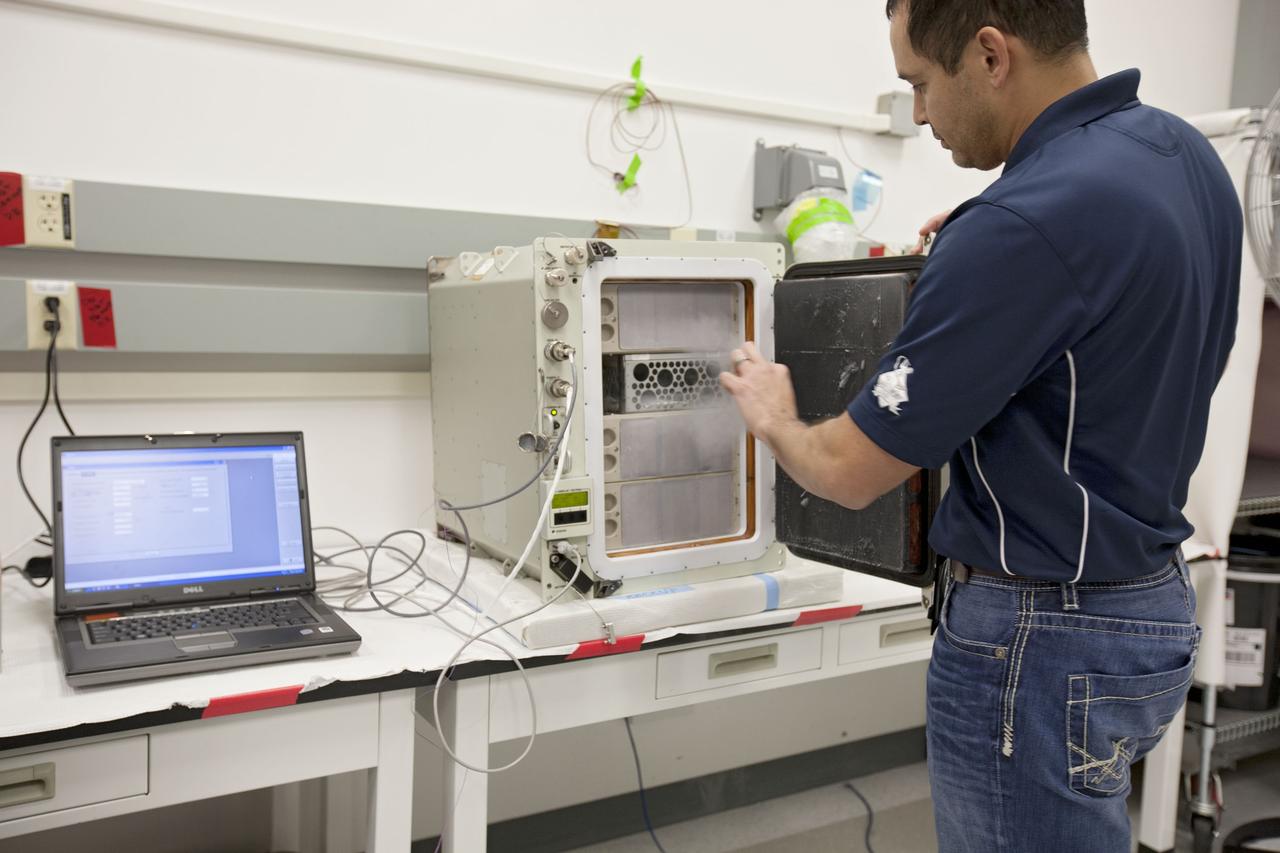 CAPE CANAVERAL, Fla. –Inside the Space Station Processing Facility at NASA’s Kennedy Space Center in Florida, a cold storage team member prepares an International Space Station experiment cryogenic freezer called a Glacier unit, for transport to Space Launch Complex-40 at Cape Canaveral Air Force Station. The unit is for an experiment late-load demonstration test with the Space Exploration Technologies Corp. SpaceX Falcon 9 rocket and Dragon capsule.       SpaceX is one of two companies under contract with NASA to take cargo to the International Space Station. NASA is working with SpaceX to combine its last two demonstration flights, and if approved, the Falcon 9 would launch the Dragon capsule to the orbiting laboratory for a docking within the next several months. Photo credit: NASA/Amanda Diller